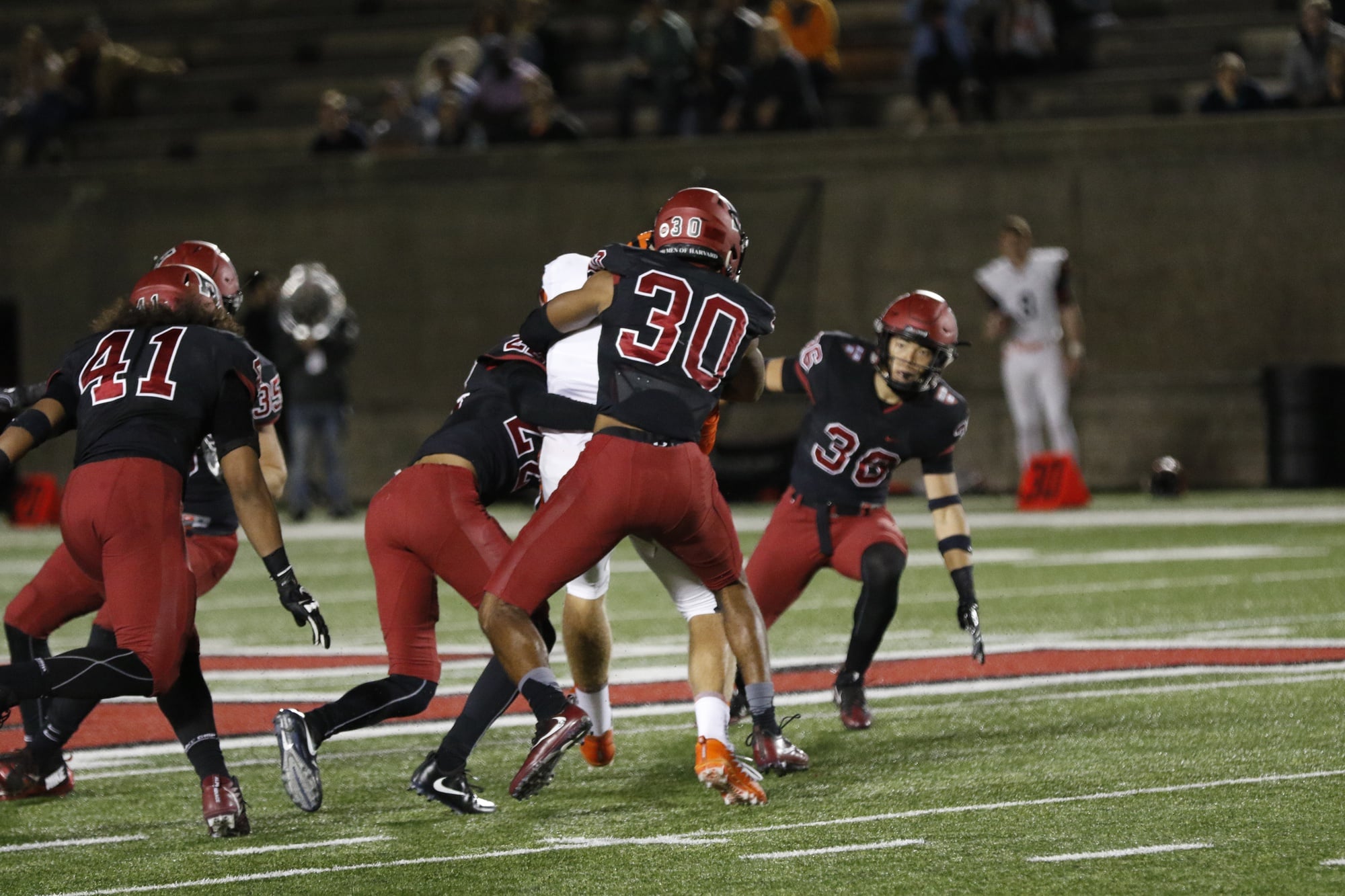 Senior safety Zach Miller wraps up a Princeton defender in a 52-17 loss.