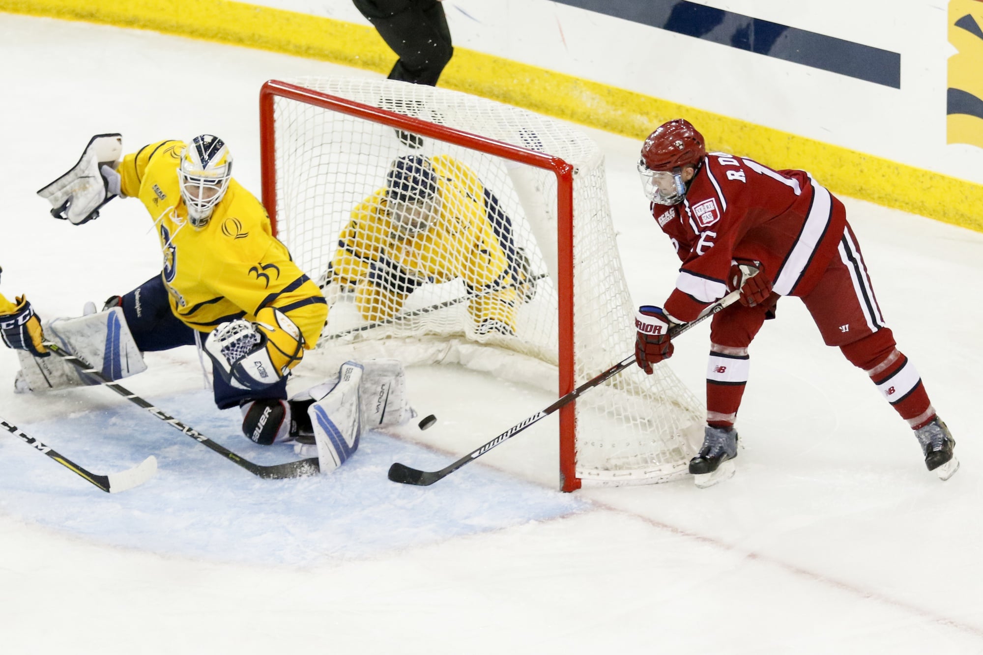 Junior forward Ryan Donato punches in his second goal of the night on a wrap-around effort, just barely beating Shortridge moving pipe-to-pipe.