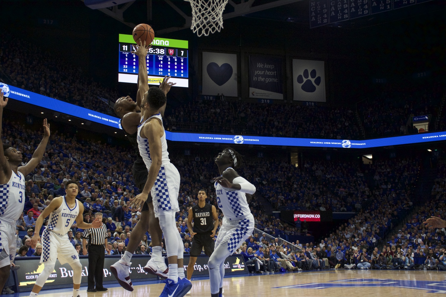 The Kentucky defense rises for one of its nine blocks on the day.
