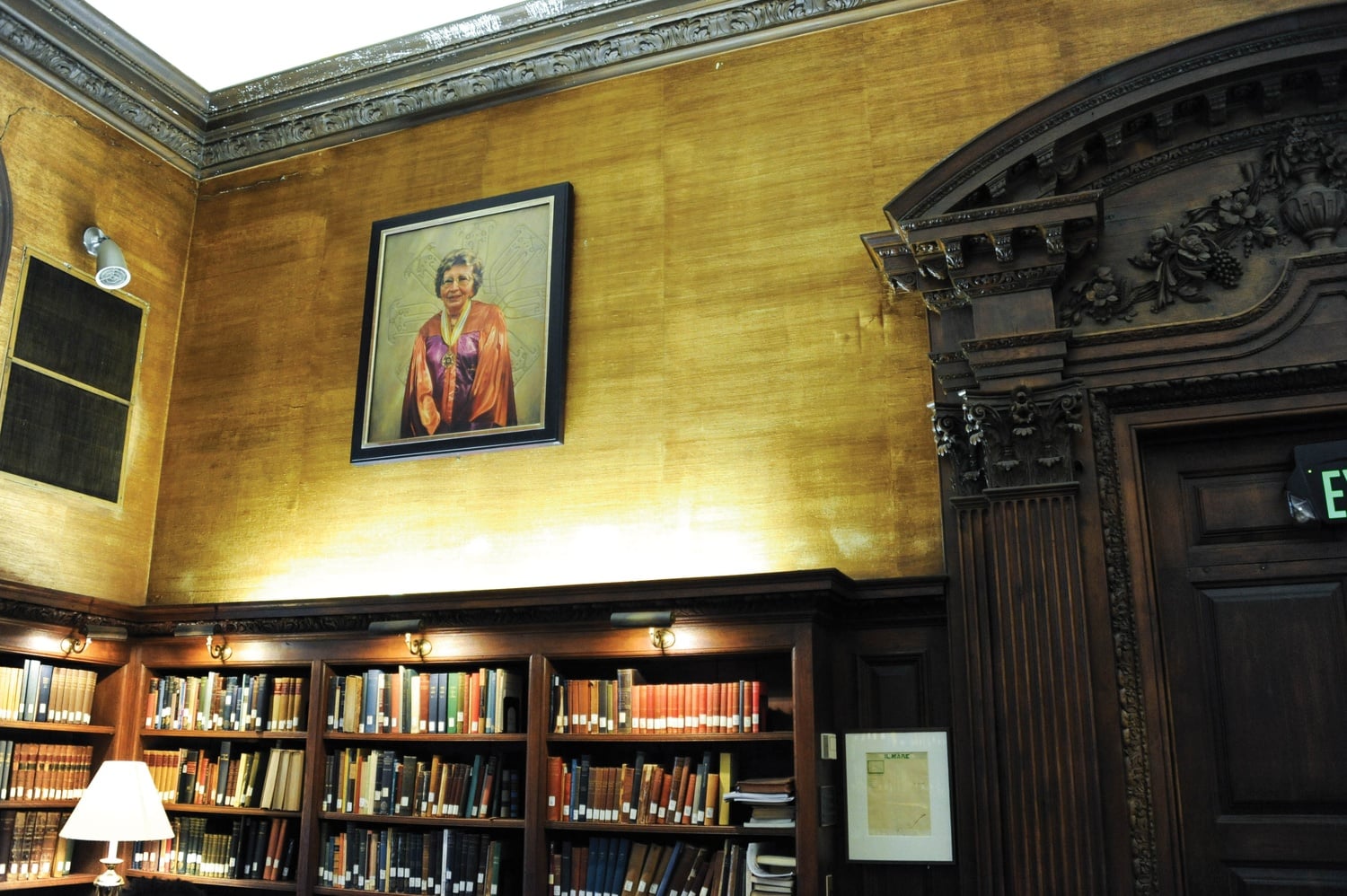 A portrait of Annemarie Schimmel, an influential scholar of Islam, hangs on the wall in Eliot House Library Thursday evening. The portrait is one of many painted by artist Stephen E. Coit '71 displayed around campus.