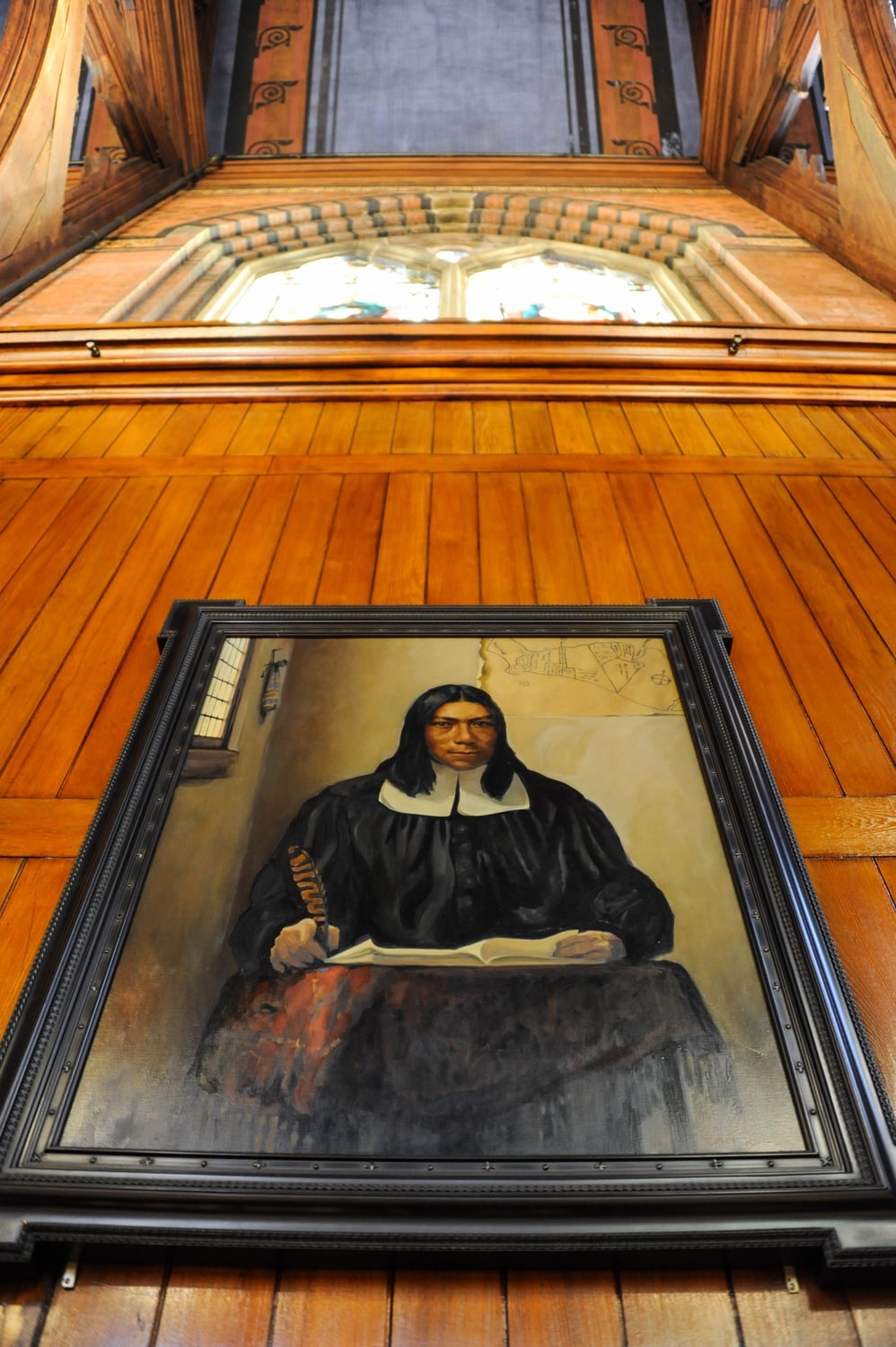 A portrait of Caleb Cheeshahteaumuck, the first Native American graduate of the University, hangs on the wall in Annenberg Hall. The portrait is one of many painted by artist Stephen E. Coit '71 displayed around campus.