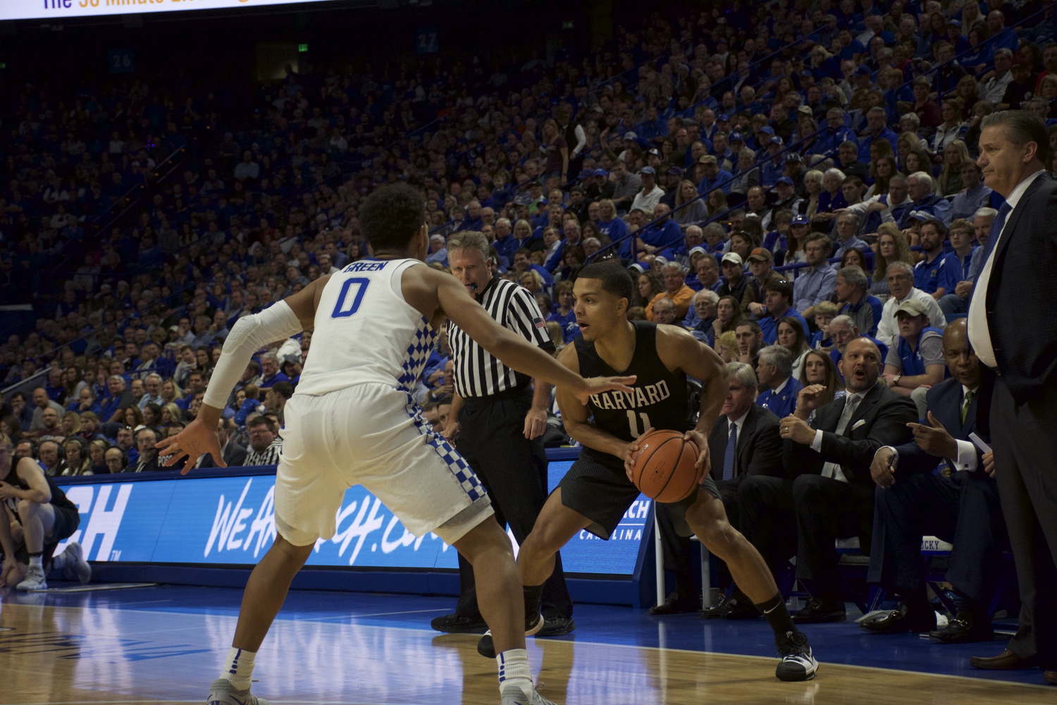 Sophomore guard Bryce Aiken looks to make a pass to a teammate during Harvard’s loss against Kentucky last Saturday. 