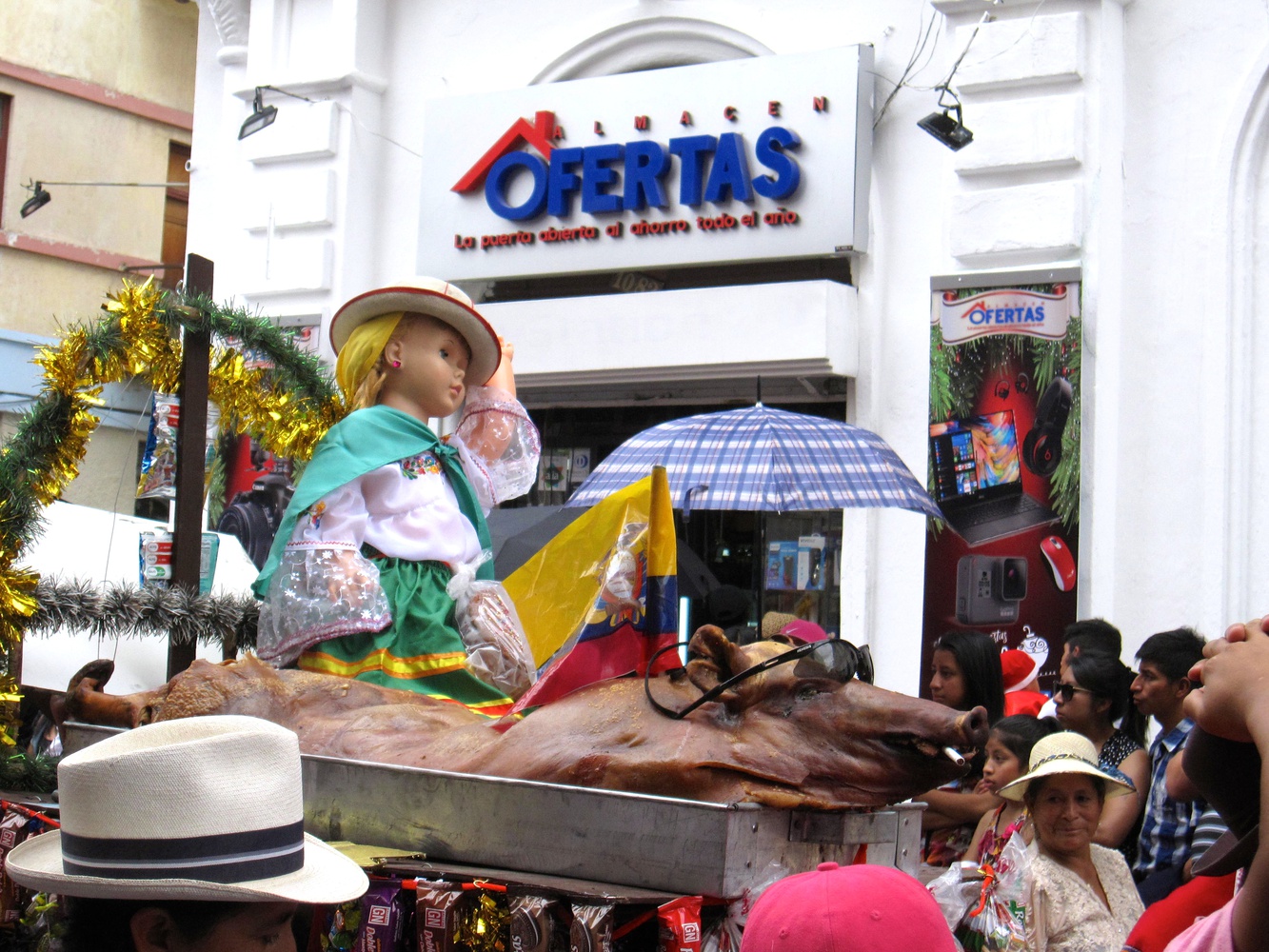  A float in Cuenca’s Pase del Niño parade features a doll atop a roast pig. The name of the parade refers to a statue of the baby Jesus that was blessed by the Pope in 1961 and then returned to Ecuador.