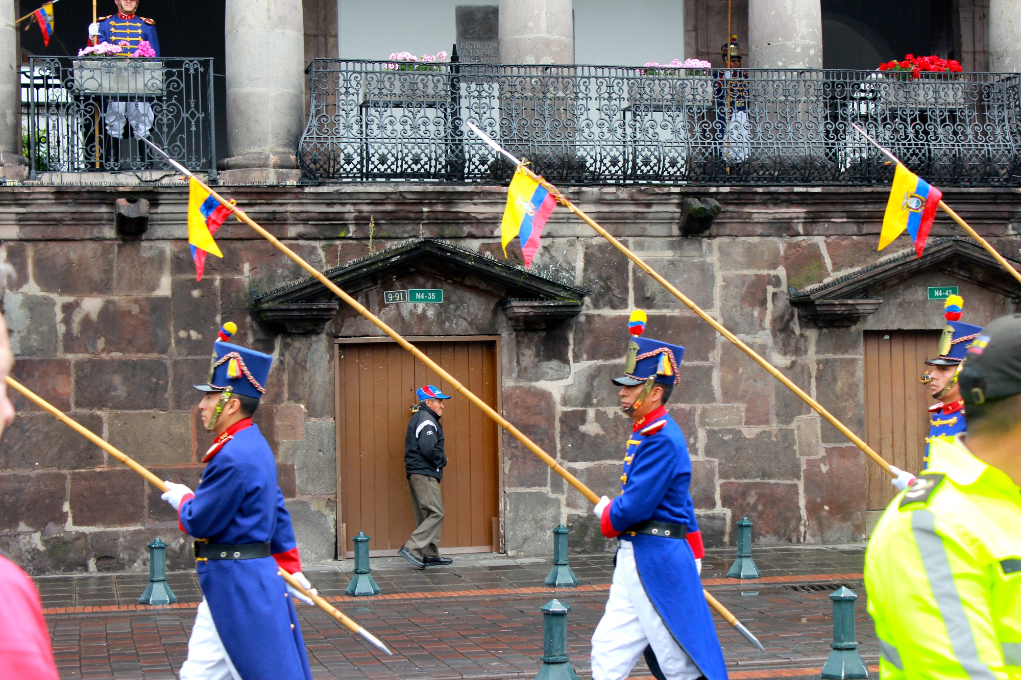 A man passes on the opposite side of the street during the Changing of the Guards at Quito’s Presidential Palace on New Year’s Day. This half-hour event occurs every Monday and attracts a large crowd of locals and tourists even on rainy days—the guards sing, play instruments, ride horses and are sometimes greeted by the President himself.