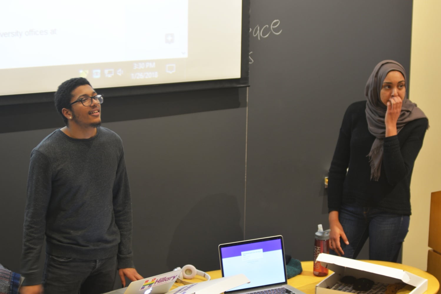 Student government representatives Nicholas Whittaker '19, left, and Salma Abdelrahman '20, right, lead a 2018 town hall meeting on a proposal to establish a multicultural center on campus.