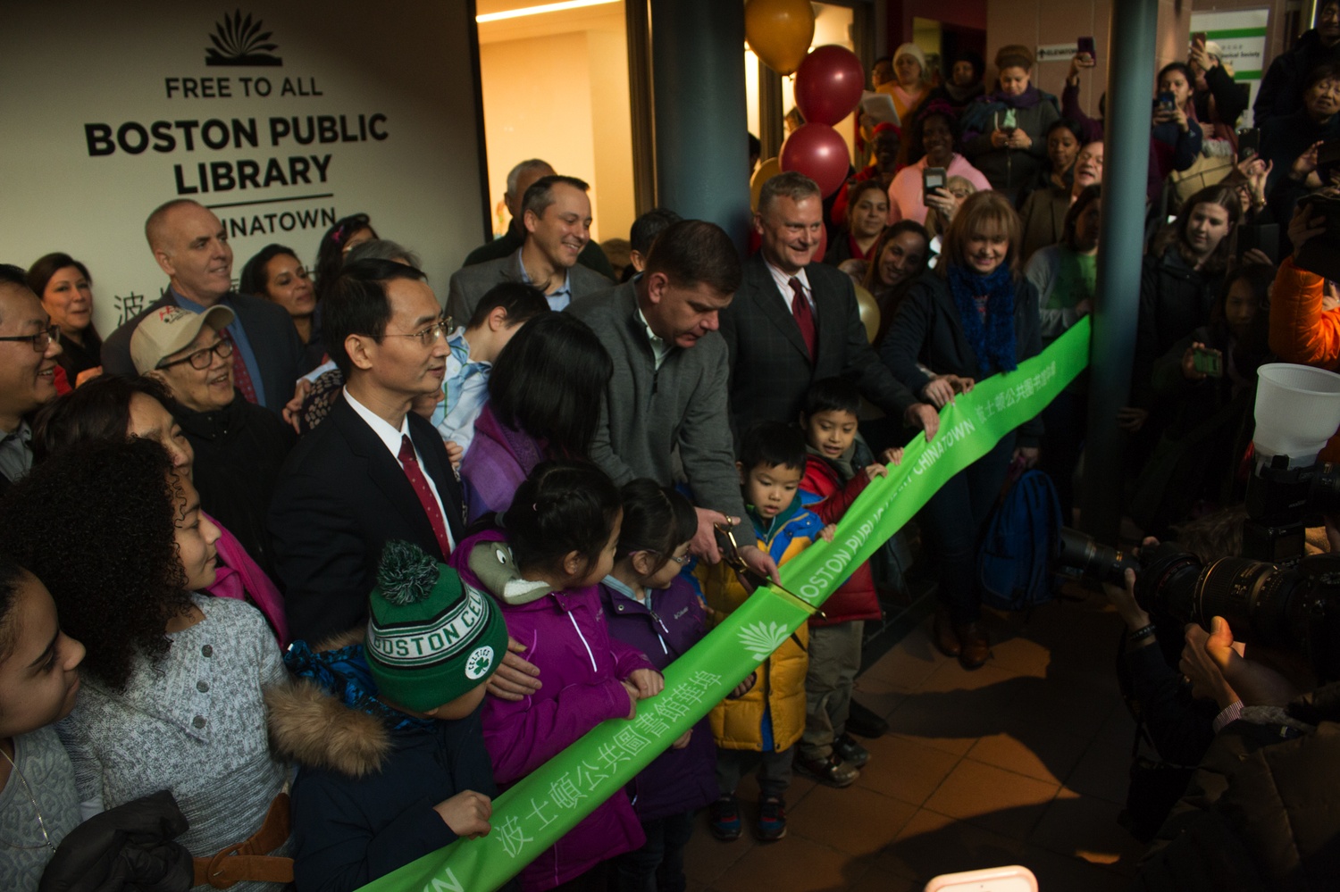 Mayor Marty Walsh cuts the ribbon at the new Chinatown Boston Public Library.