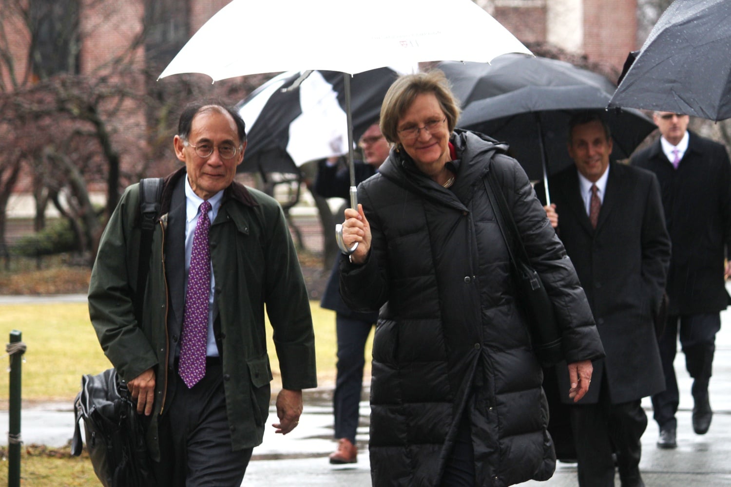 Drew G. Faust and William F. Lee '72 walking to the press conference to announce the next president of Harvard University on Feb. 11, 2018.