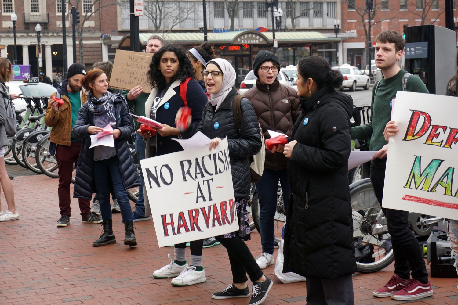 Picketers march in front of Smith Campus Center during a rally hosted by the Harvard Union of Clerical & Technical Workers.