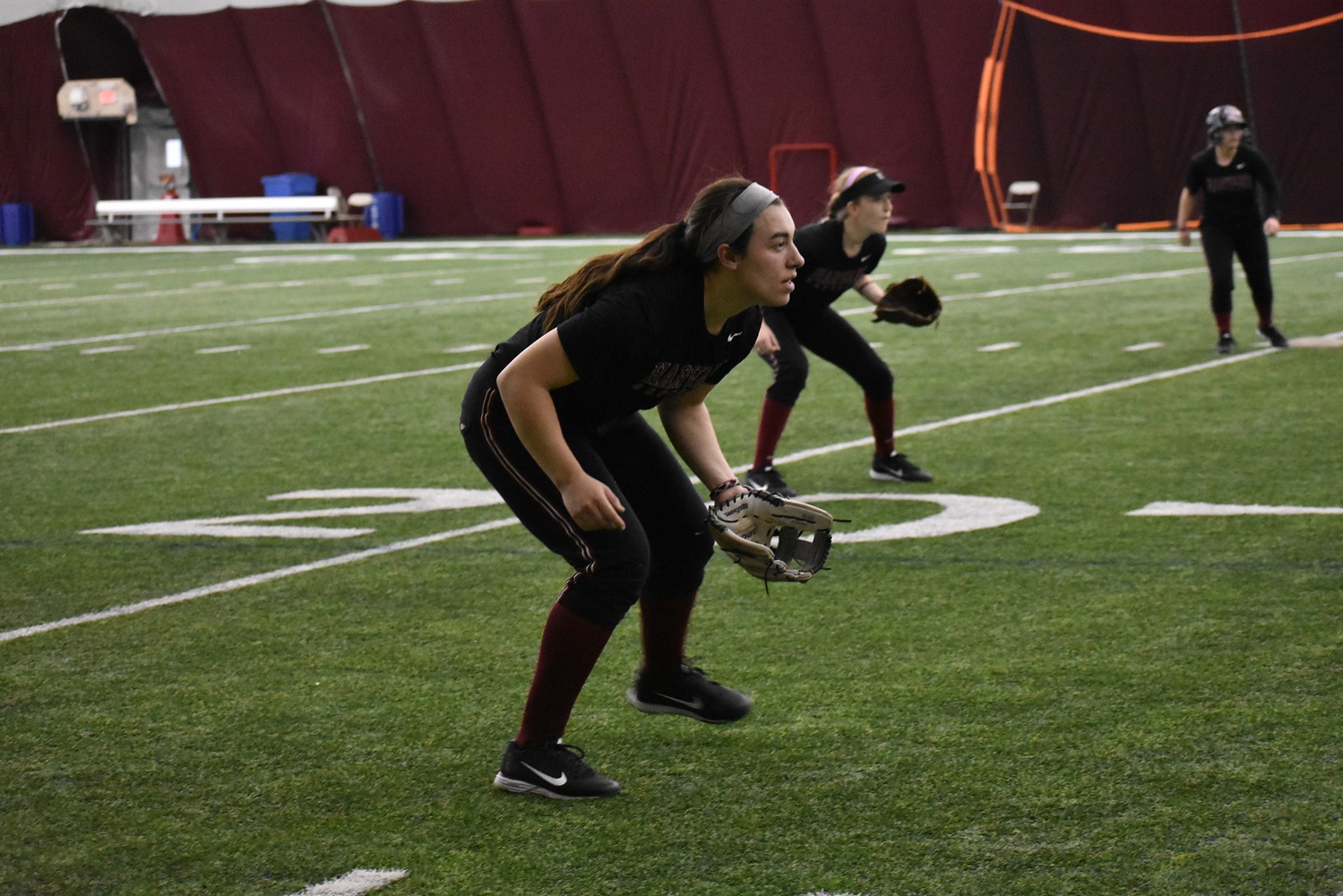 Infielders get set in an indoor scrimmage. 
