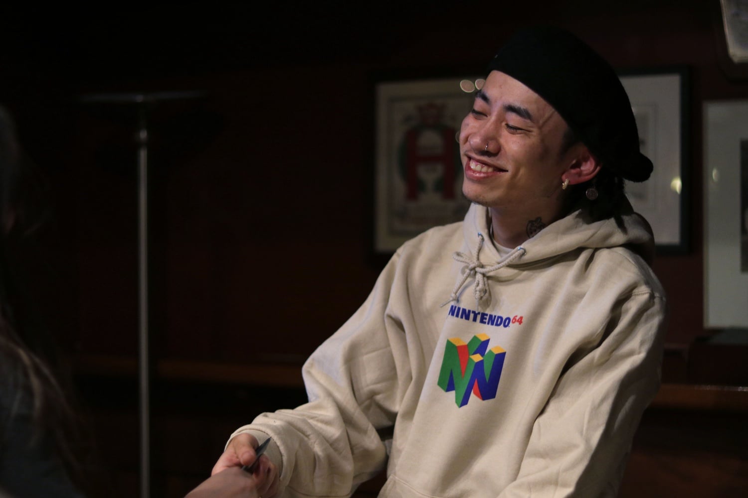 MaSiWei, an artist with 88rising, signs autographs.