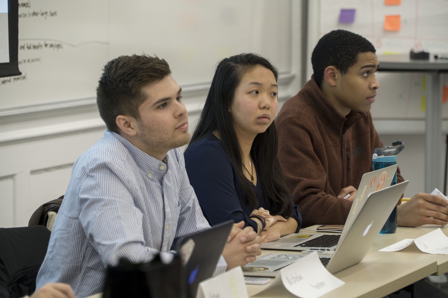 Catherine L. Zhang '19, Nicholas D. Boucher '19, and Jackson C. Walker '21 listen in on a conversation regarding HCFA on Sunday evening at a UC meeting.