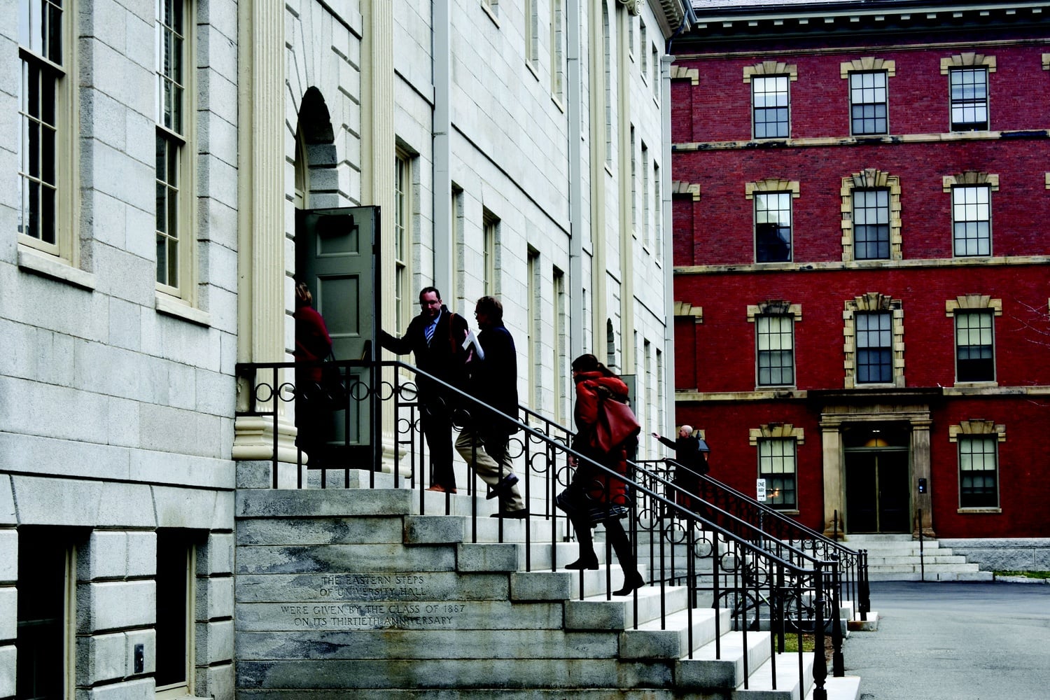 Professors enter University Hall for the monthly Faculty of Arts and Sciences meeting Tuesday.