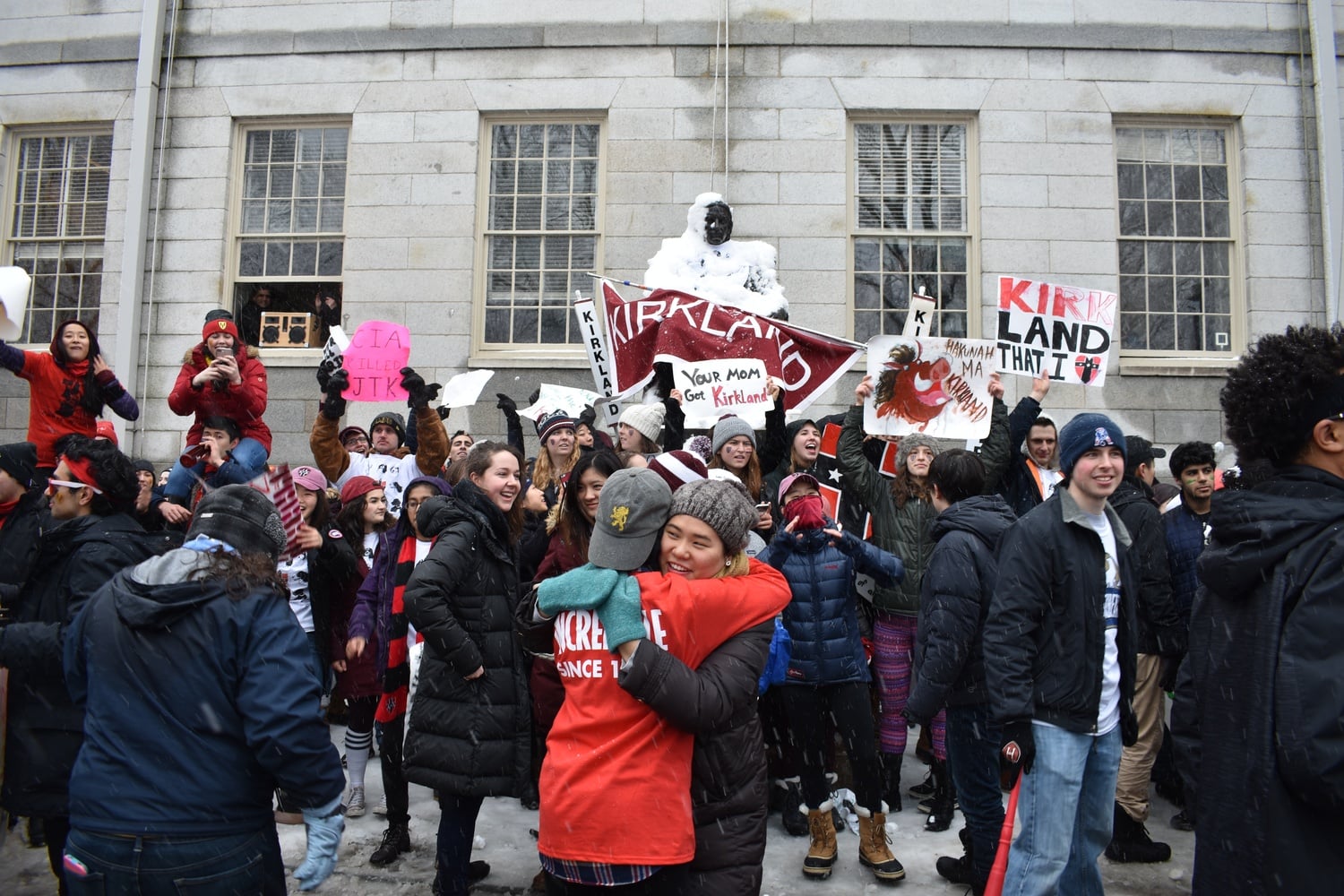 Upperclassmen students gathered in front of the John Harvard statue at Housing Day in 2018.