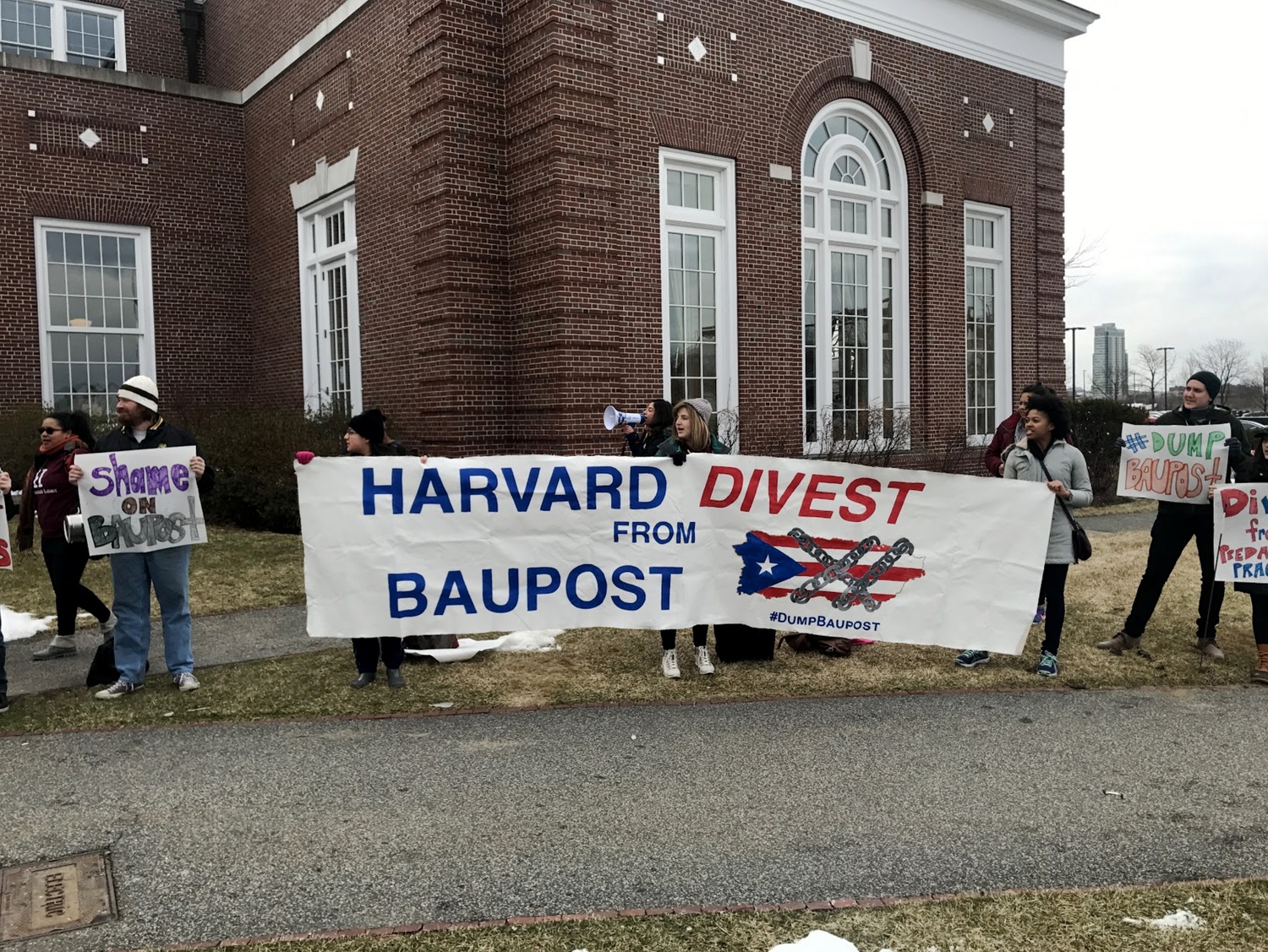 Harvard affiliates protest the appearance of the Baupost Group's CEO, Seth A. Klarman, at a Harvard Business School event Saturday morning.