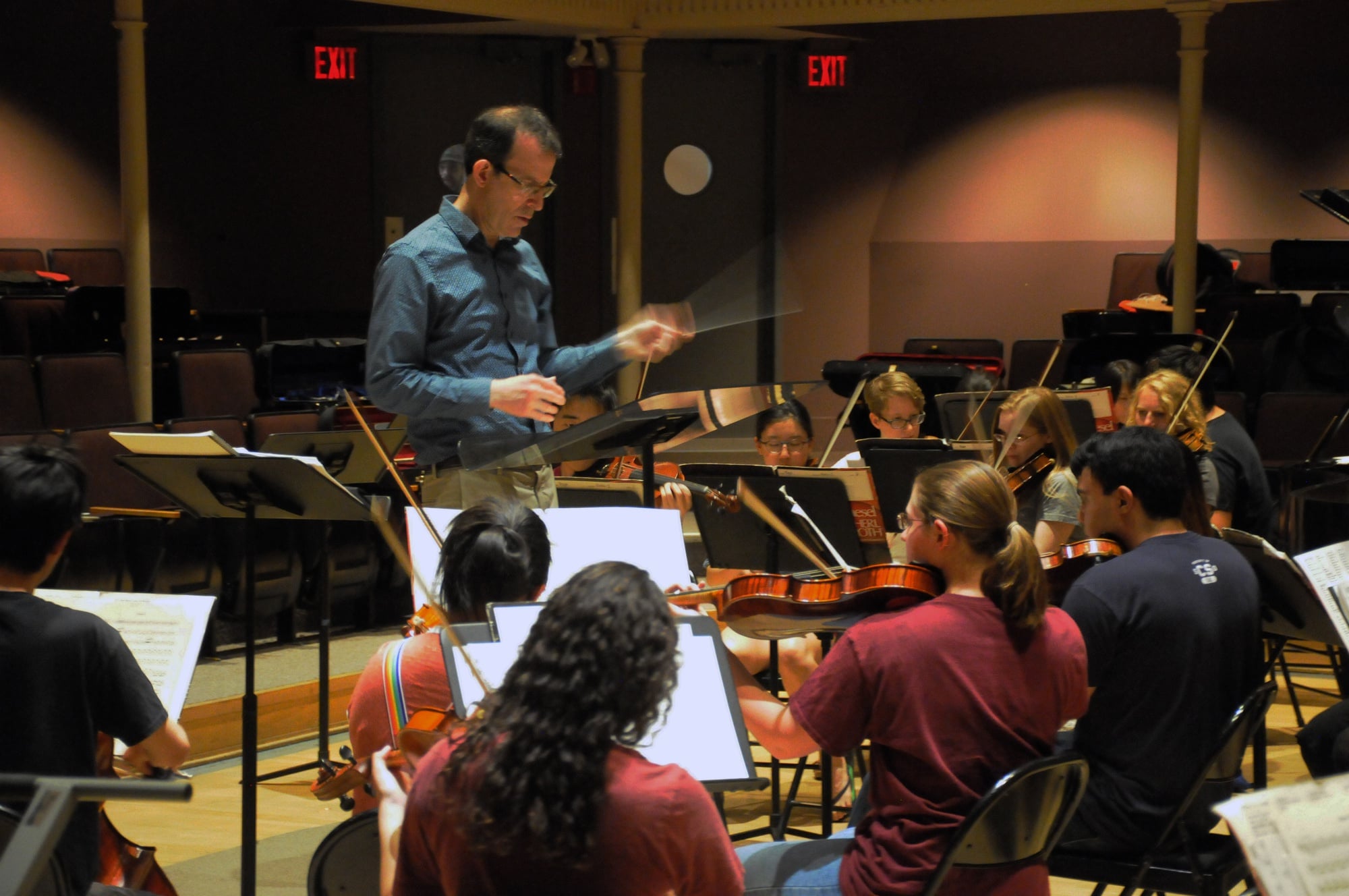 Allen G. Feinstein ’86 conducts the Harvard Pops Orchestra at a dress rehearsal in preparation for their spring 2017 show "Mission ImPOPSible."