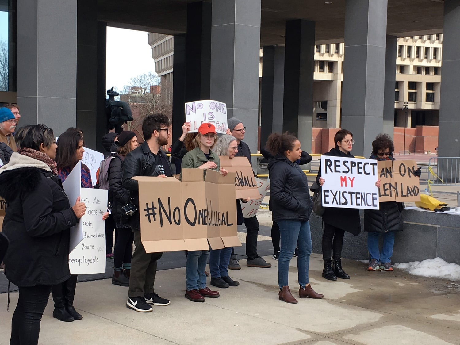 Harvard professors and affiliates protest in support of DACA/TPS in front of the JFK Building in Boston in March.