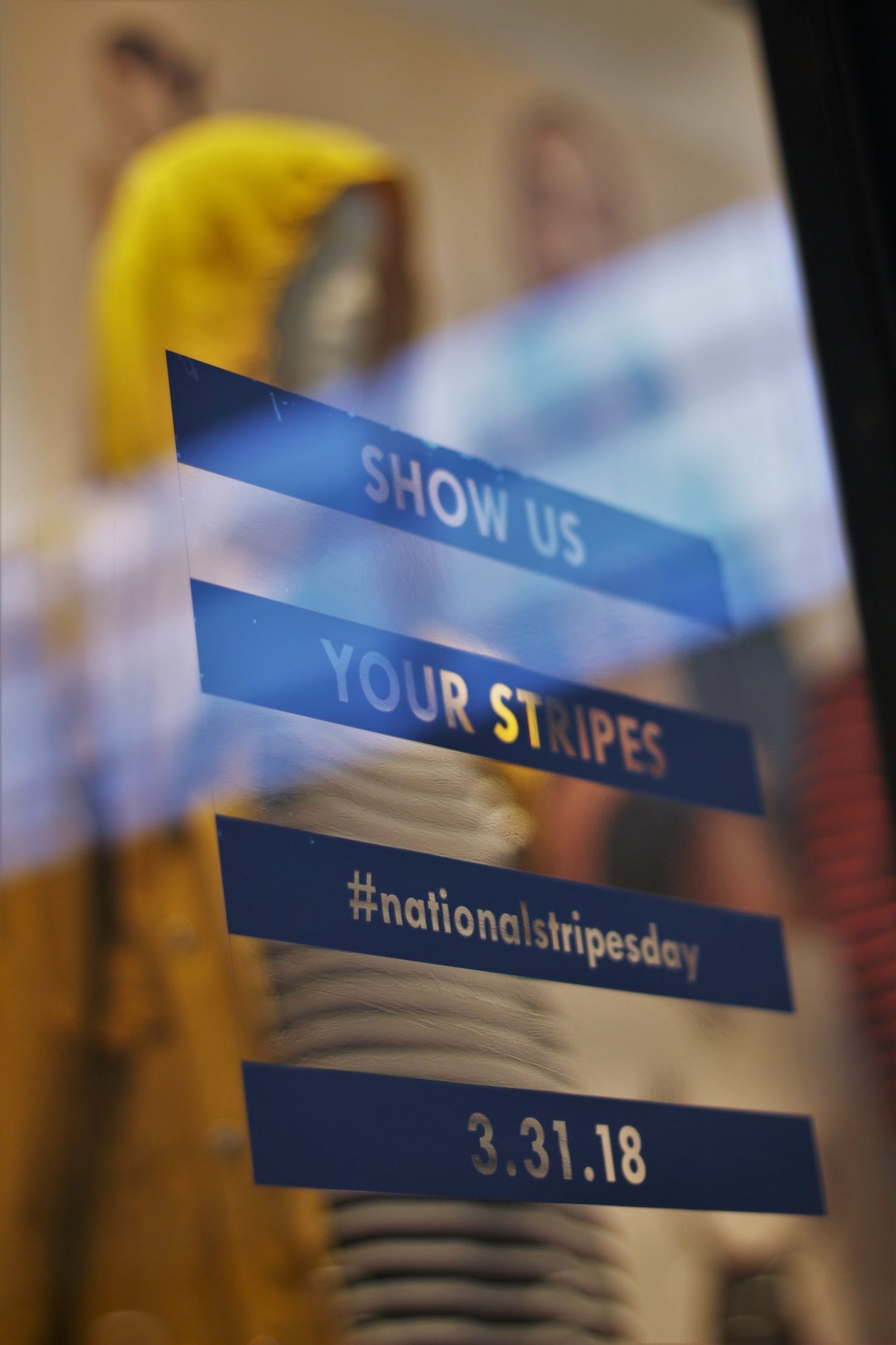 The J.Crew storefront at Copley Place advertises National Stripes Day.