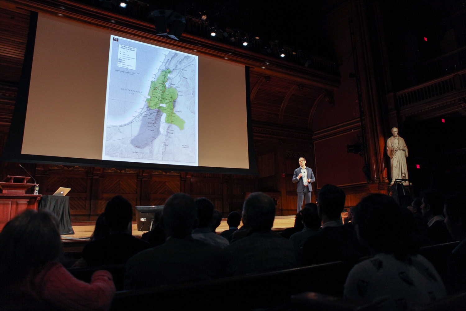 Eight Harvard Ph.D. students presented their research and innovations at a Wednesday afternoon symposium in Sanders Theatre. 