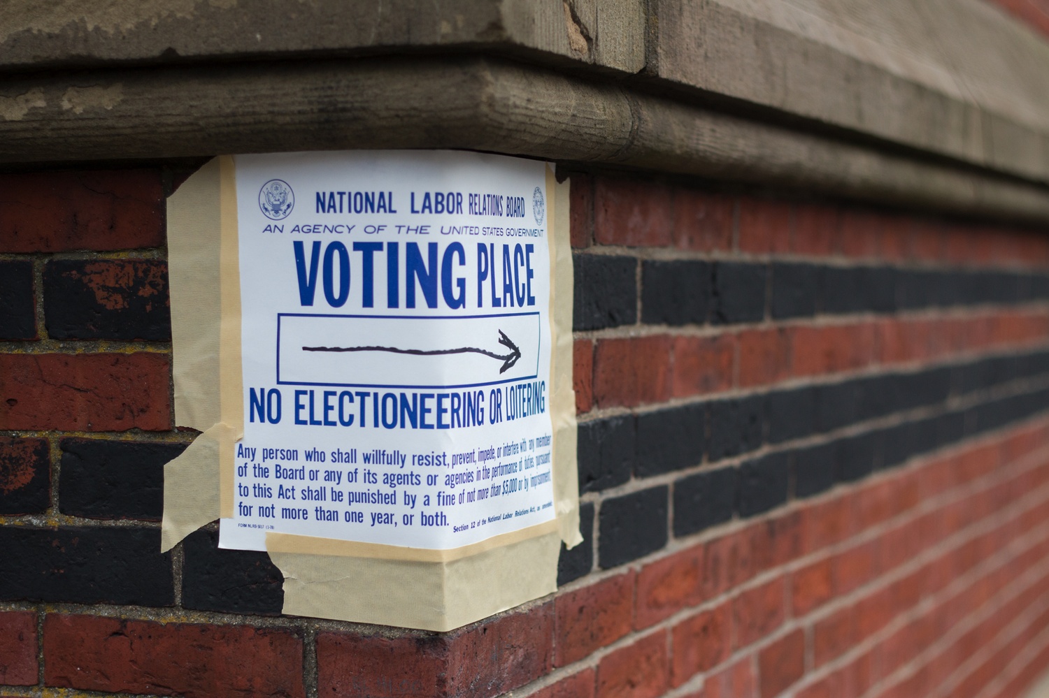 A sign pointing to a polling place during Harvard's second unionization election last month.