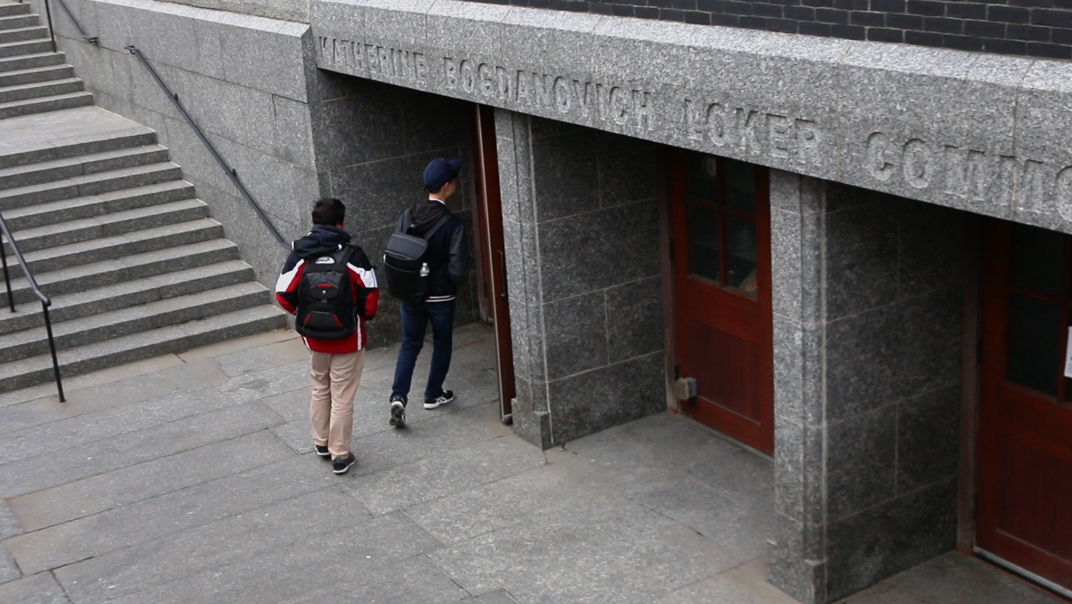 Students enter the Queen's Head pub to vote during Harvard's second unionization election in April.