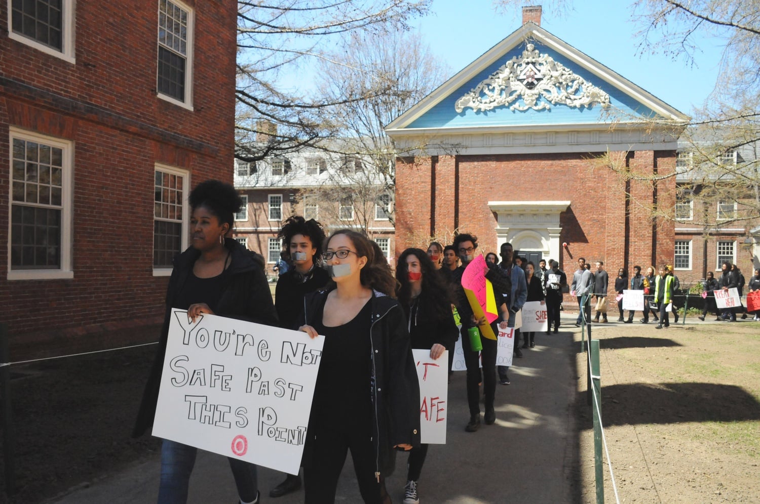 Members of Black Students Organizing for Change call for reform to Harvard policies at a protest following the arrest of a black undergraduate.