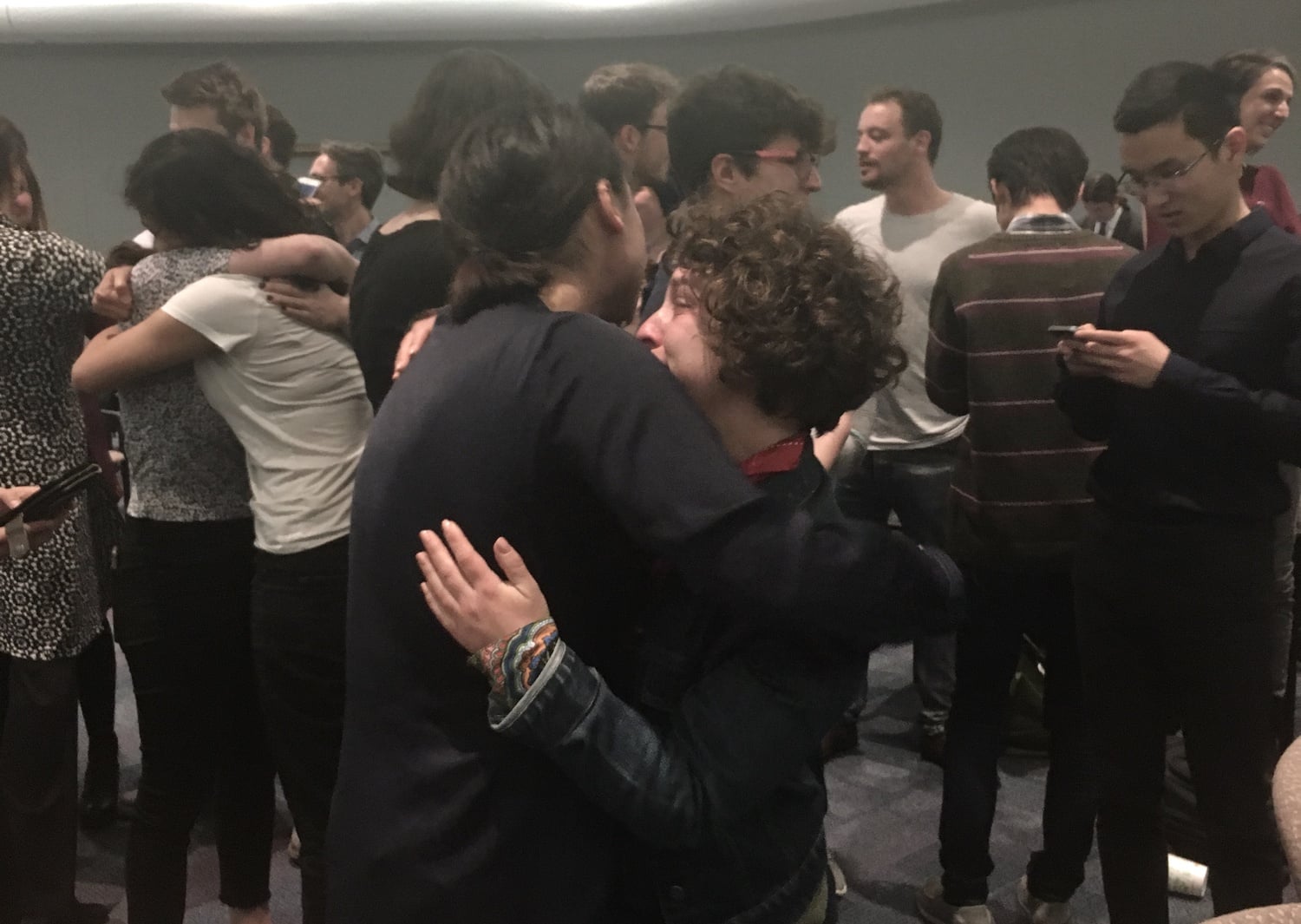 Harvard union organizers embrace following the announcement that students voted to unionize in the University's 2018 unionization election.