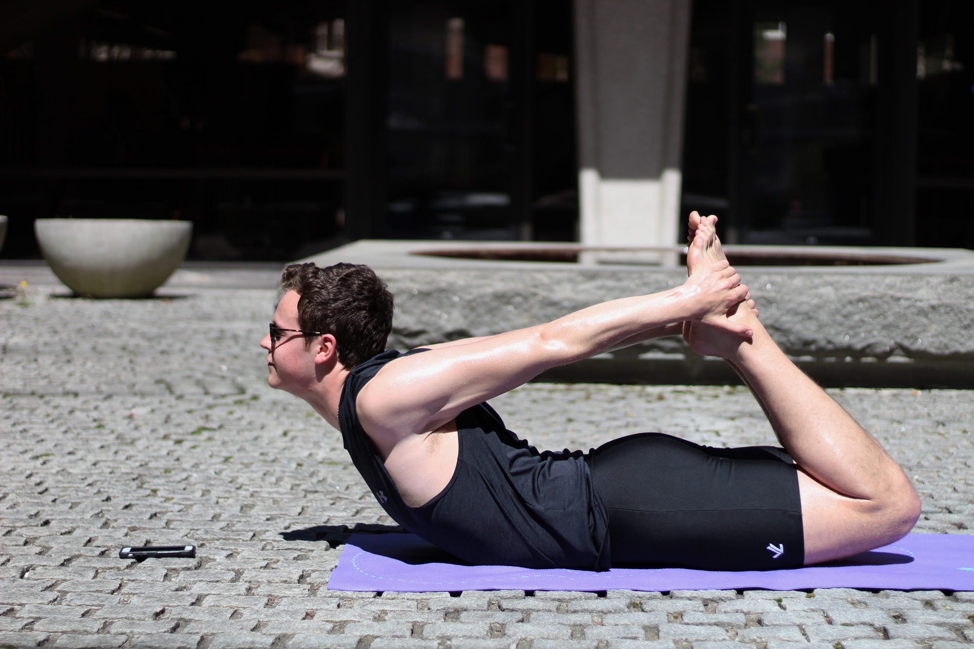 Frank M. Cahill '20 practices his yoga skills outside the SOCH.