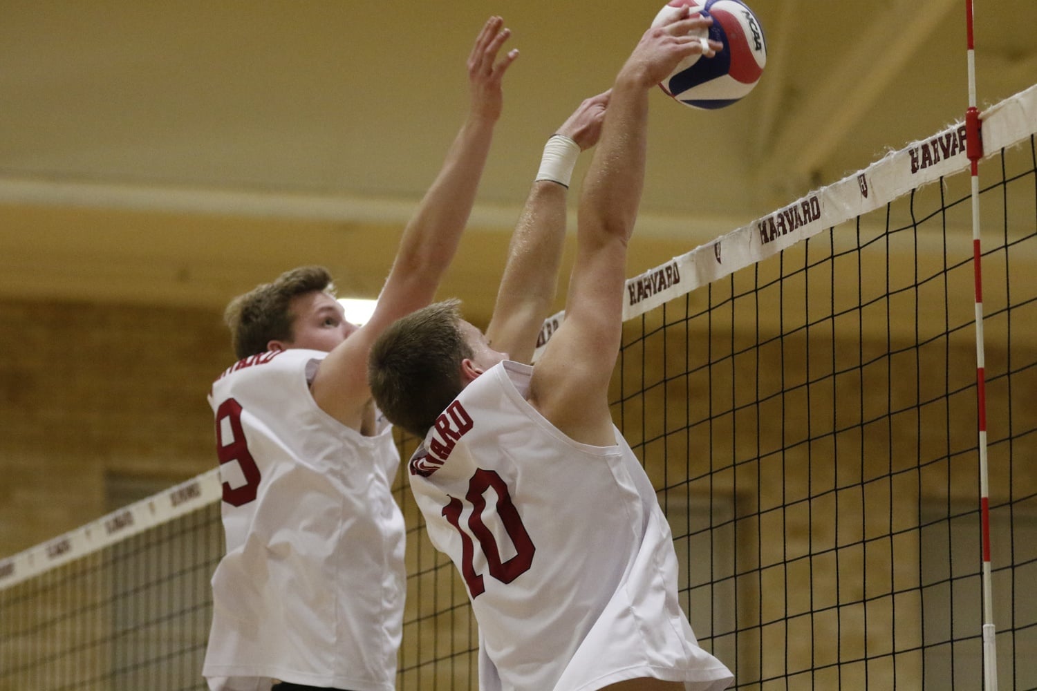Sophomore setter Matthew Ctvrtlik and co-captain Riley Moore team up for a block on the net. Overall, the team registered 224 blocks throughout the season.
