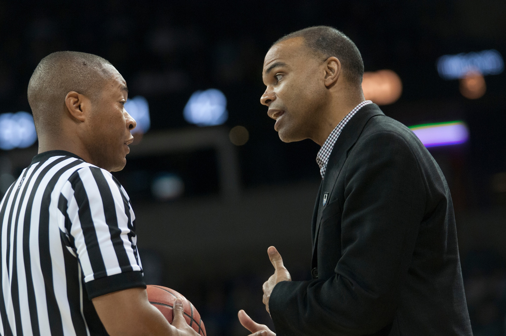Coach Amaker talks with a ref during the Crimson’s 2014 NCAA tournament game against Michigan State. The Crimson advanced to the third round that year after a win against Cincinnati. It marked Amaker’s third tournament appearance in a row.