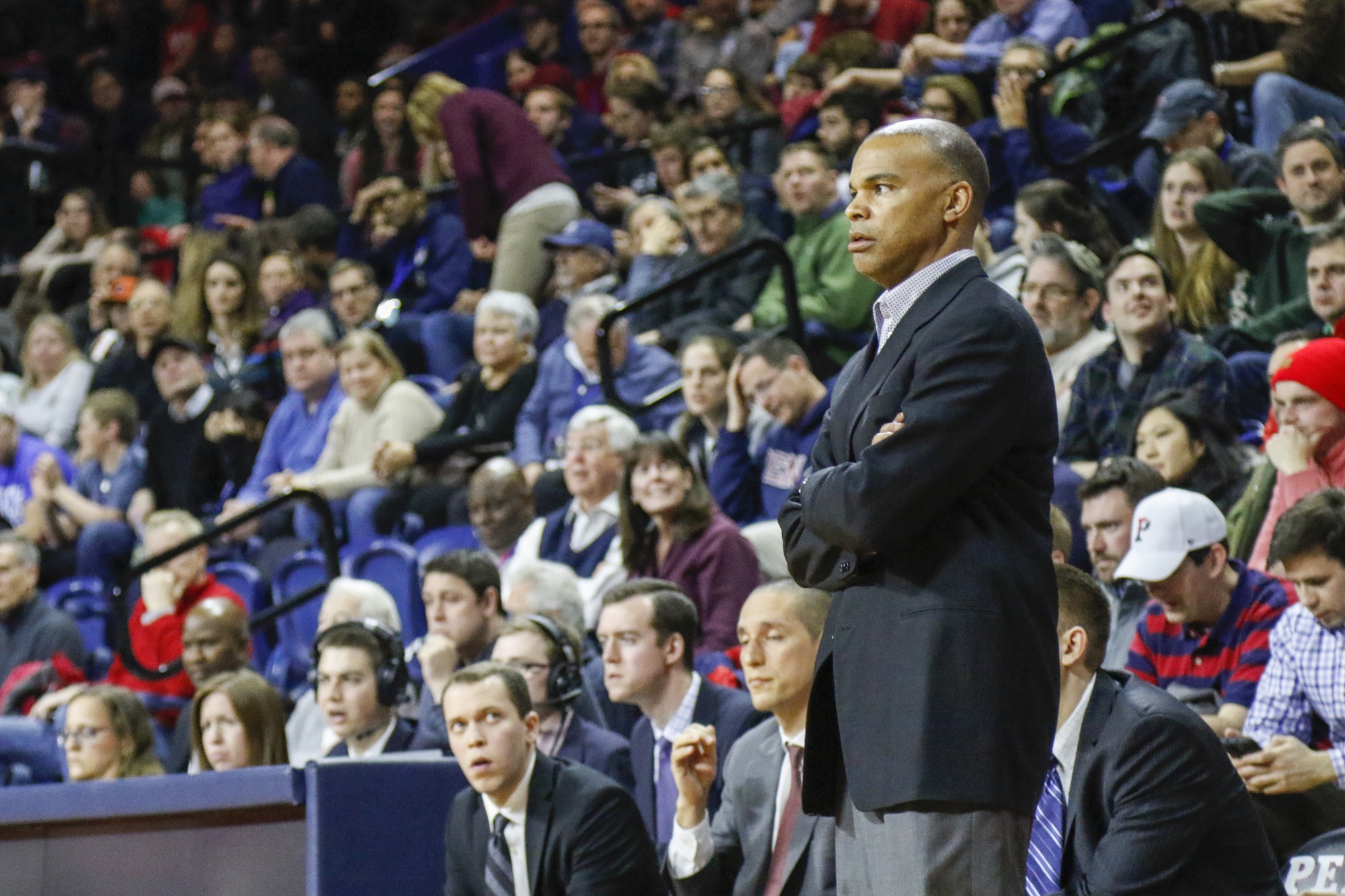 Coach Amaker stands on the sidelines during the first round of the Ivy League tournament in Philadelphia. The Crimson won the game against Cornell to advance to the championship game against Penn.