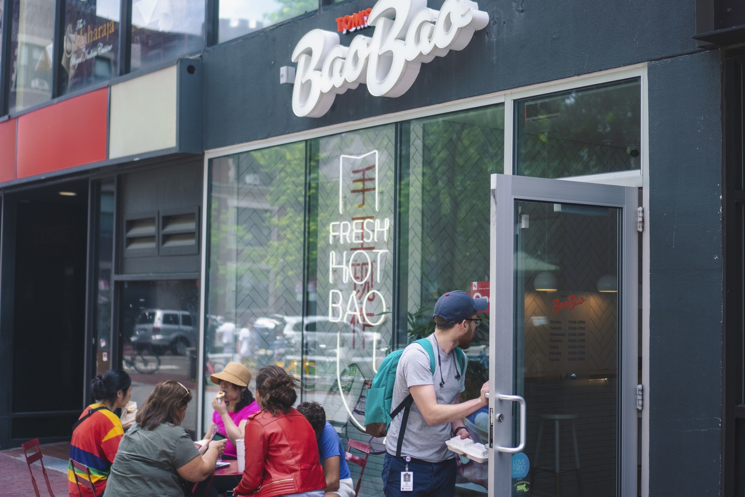Customers enjoy some fresh hot bao from Tom's BaoBao.