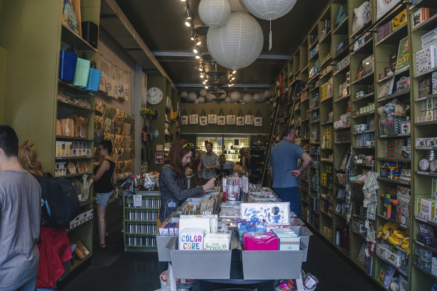 Customers browse the shelves of Black Ink. Susan Corcoran, founder of the store, wrote in an email that tourists visit her business from all of the world during the summer months.