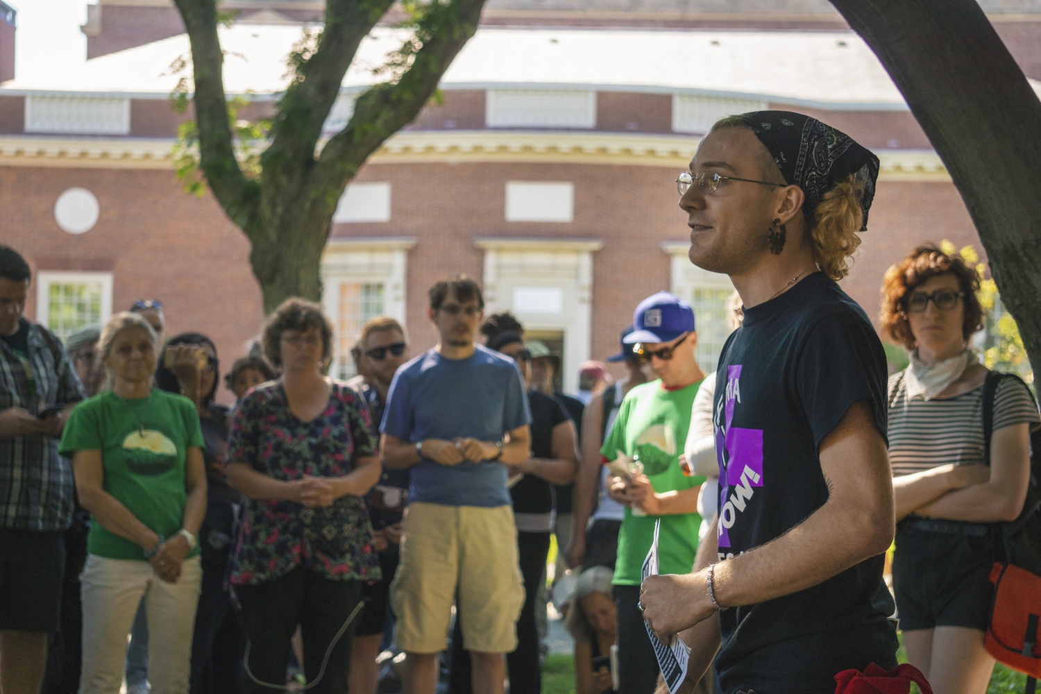A crowd gathers in front of Lamont Library on Friday afternoon to protest the Arthur M. Sackler Museum.