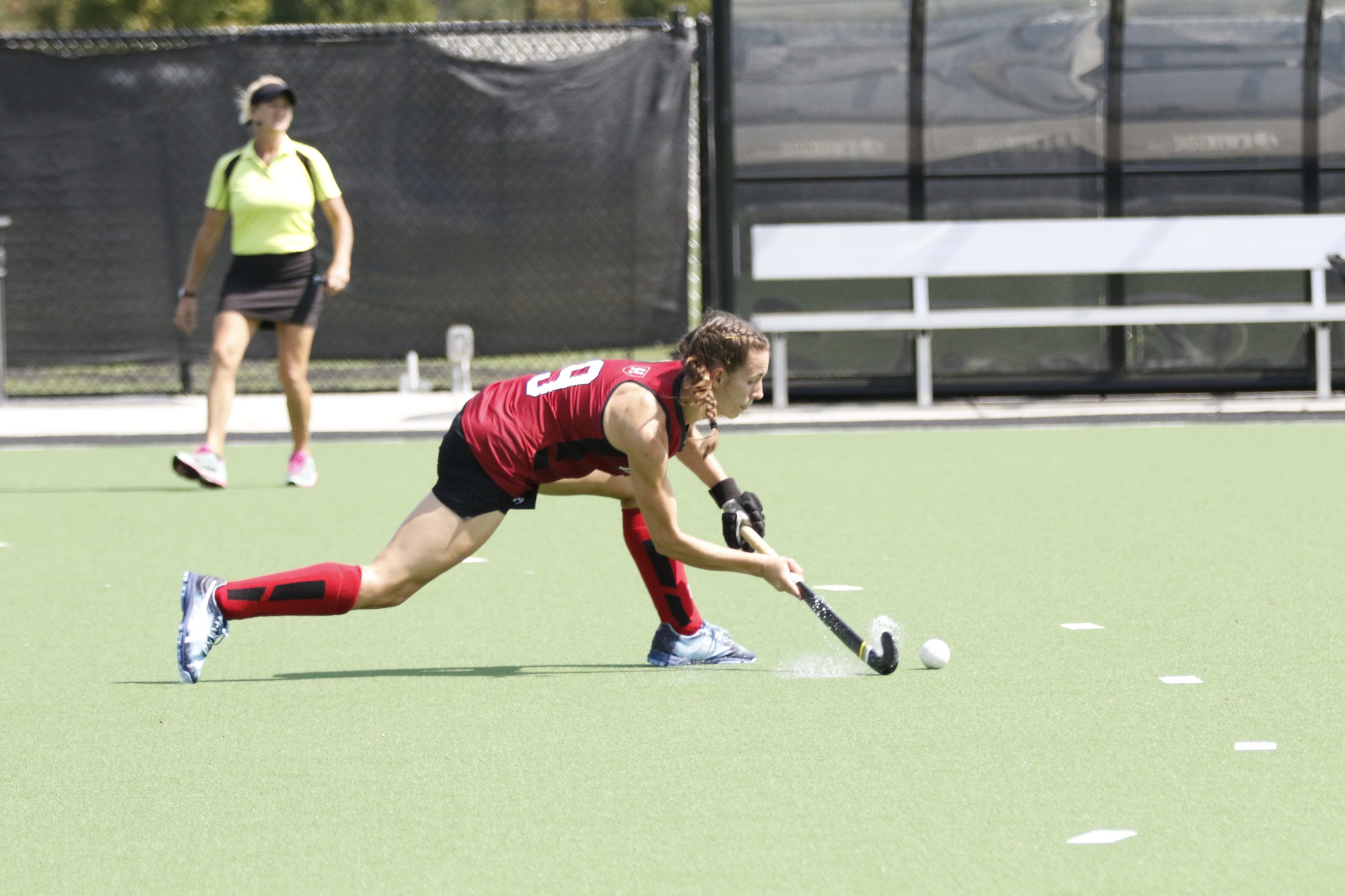 Senior Olivia Allin pushes a pass across the field