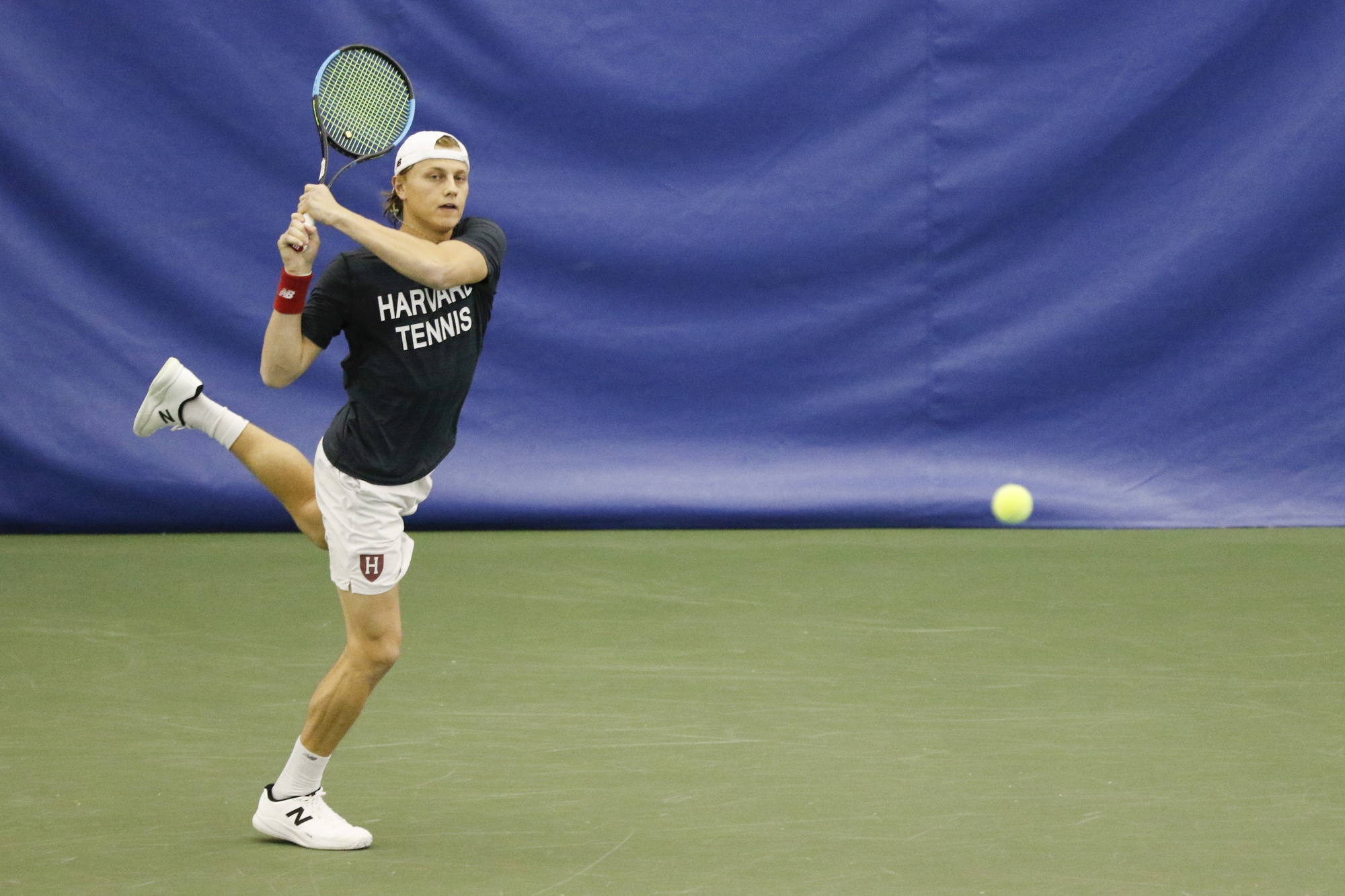 Junior Logan Weber rips a backhand in previous action