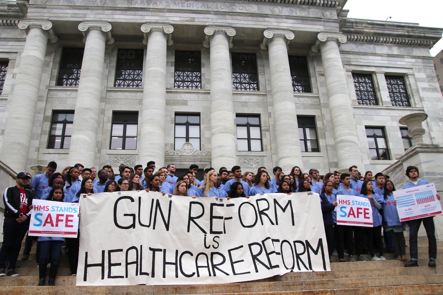 Harvard Medical School students rally against gun violence in front of Gordon Hall.