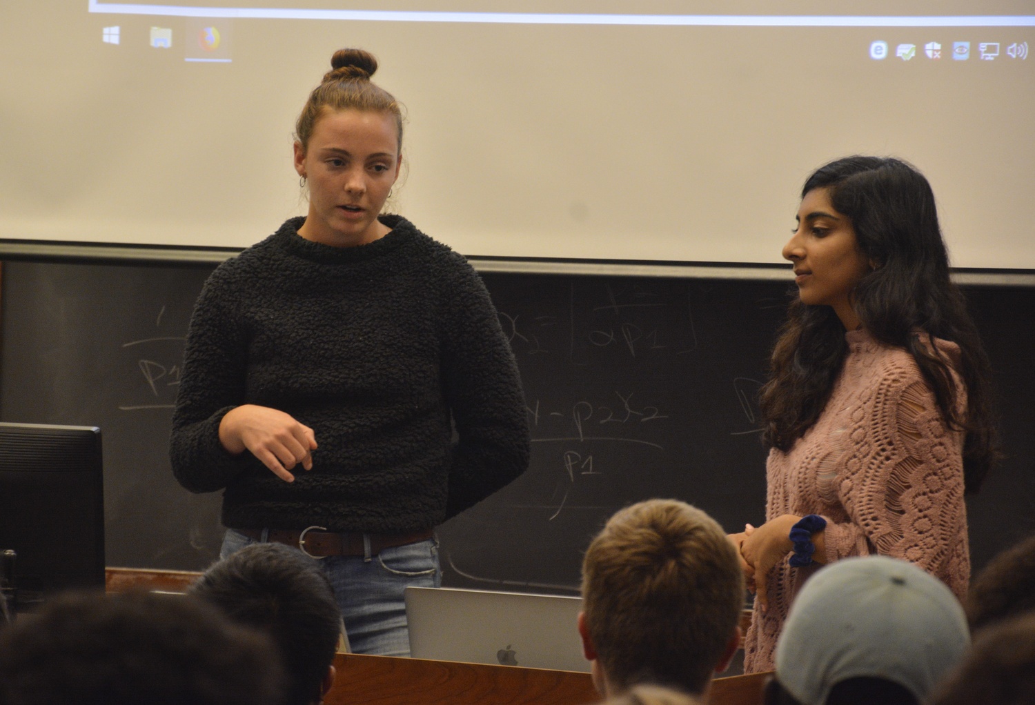 Eleanor C. "Nell" Shea '20 and Priya P. Kukreja '21 from the Harvard College Reproductive Action and Dialogue speak about the implication of Judge Brett Kavanaugh's possible confirmation during a meeting with the Harvard College Democrats and Our Harvard Can Do Better Tuesday night.