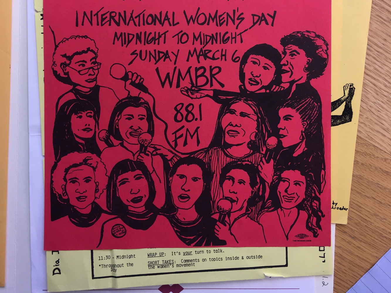 A Women's Radio poster advertising an International Women's Day broadcast.