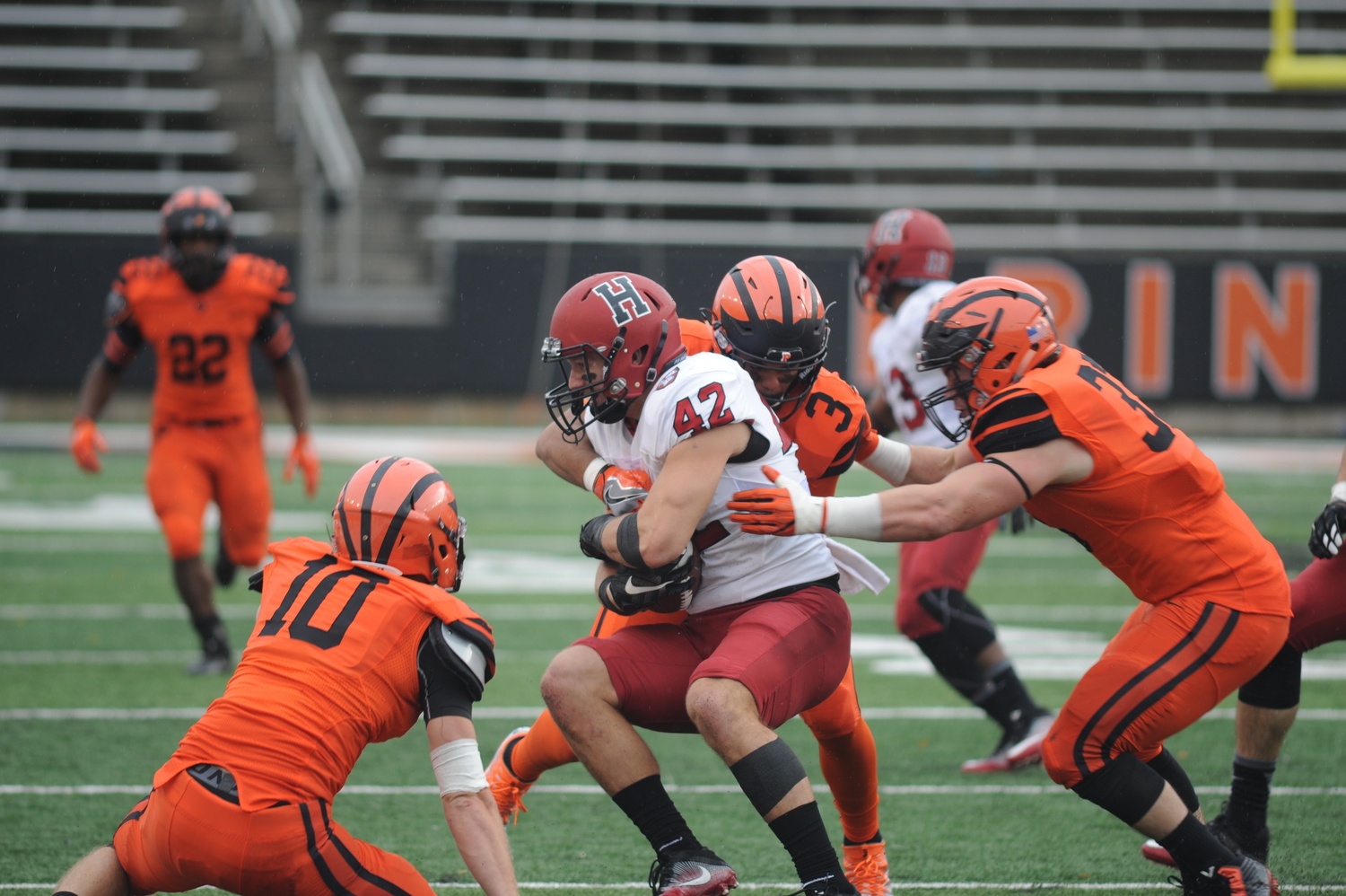 Anthony Firkser '17 battles through a group of Princeton defenders after making a catch. The former tight end is one of nine Harvard players currently on NFL rosters.