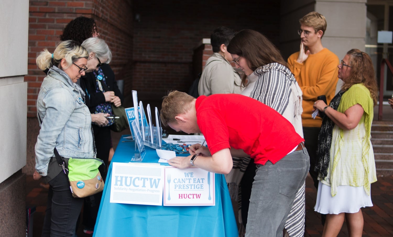 During 2018 contract negotiations with the University, members of the Harvard Union of Clerical and Technical Workers stationed themselves behind tables around campus to garner support.