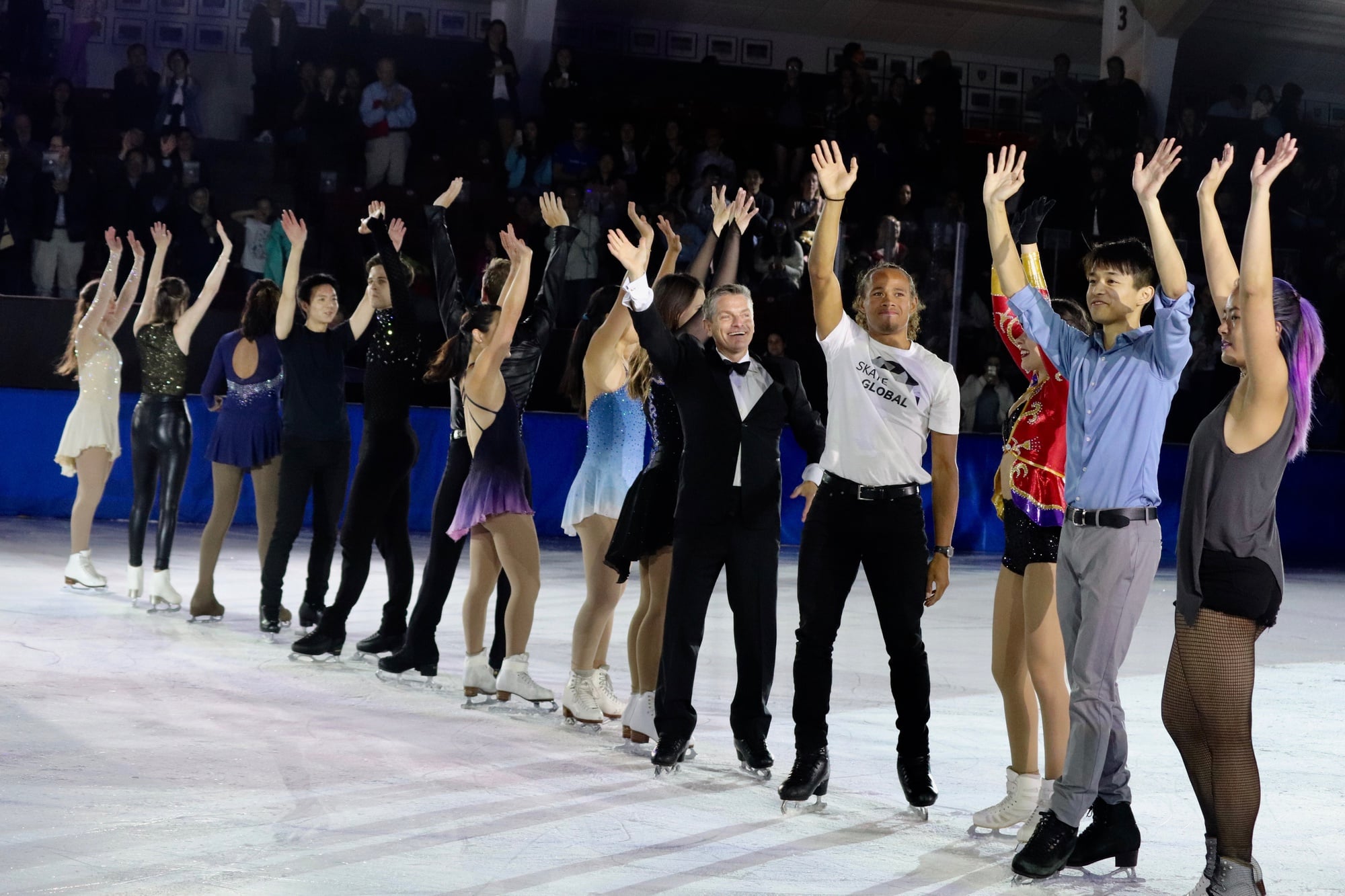 The cast of An Evening with Champions 2018 waves to the audience after taking their final bows.