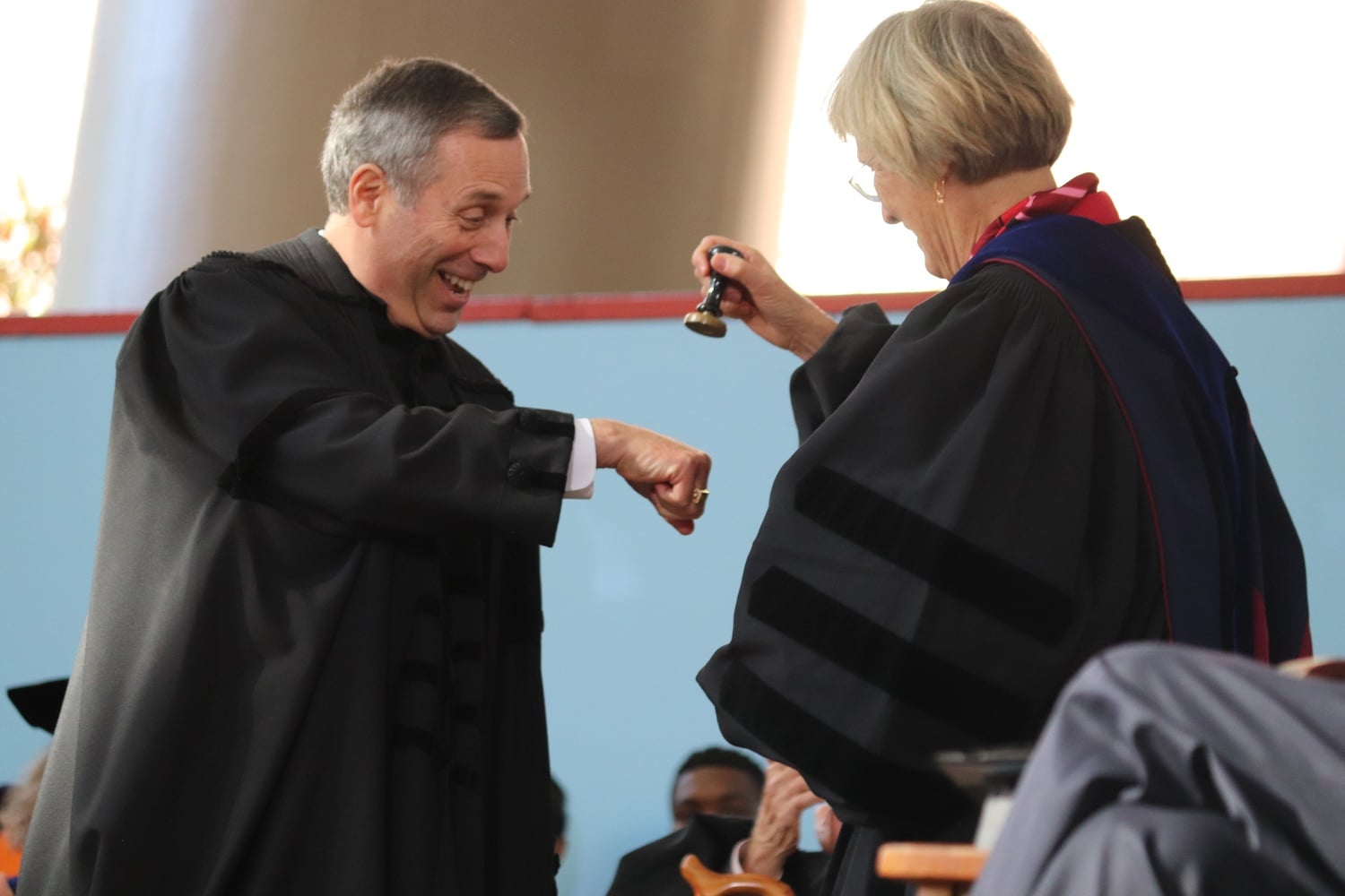 Former University President Drew G. Faust and her successor Lawrence S. Bacow share a joking moment on the day of Bacow's inauguration as Harvard's 29th president.
