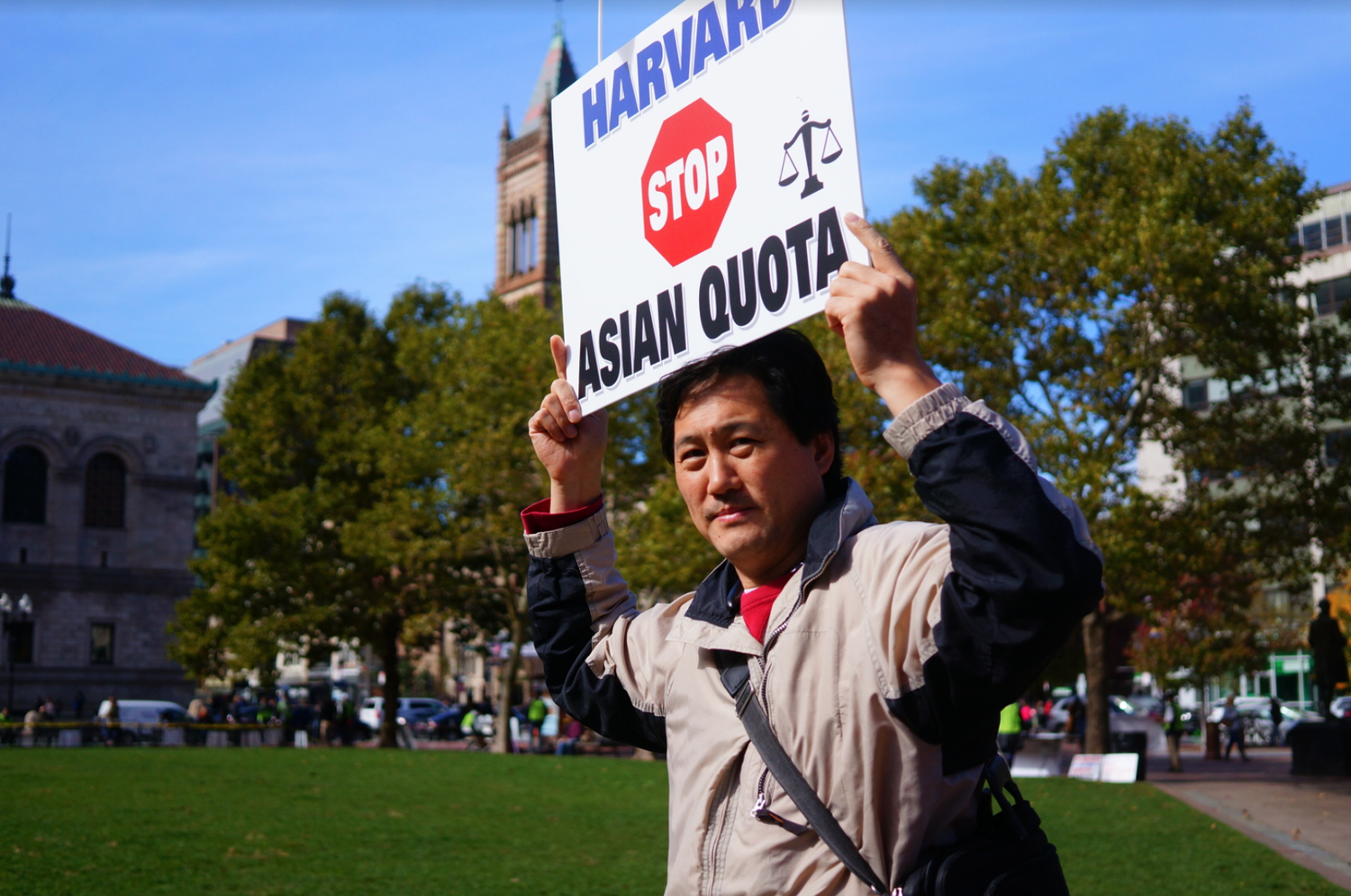 A protester at the pro-Students for Fair Admissions rally held in Copley Square Sunday. SFFA is suing Harvard over allegations it discriminates Asian-American applicants.