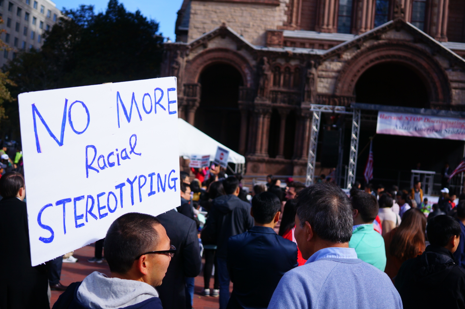 Demonstrators mill around during a pro-Students for Fair Admissions rally held in Copley Square Sunday.