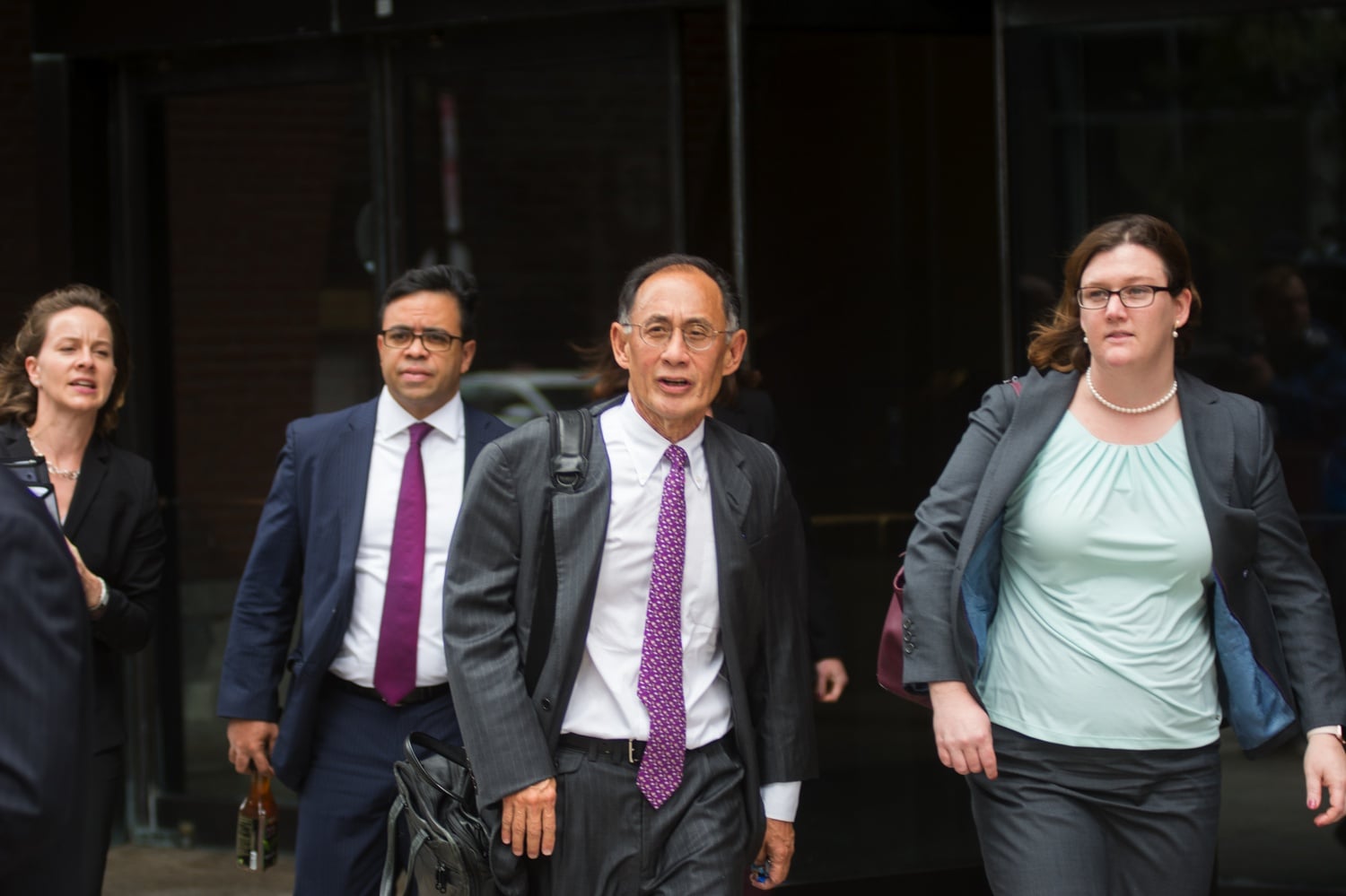 William F. Lee ’72, who is leading the legal team defending the University against allegations of racial discrimination, enters the courthouse on day one of the Harvard admissions trial.