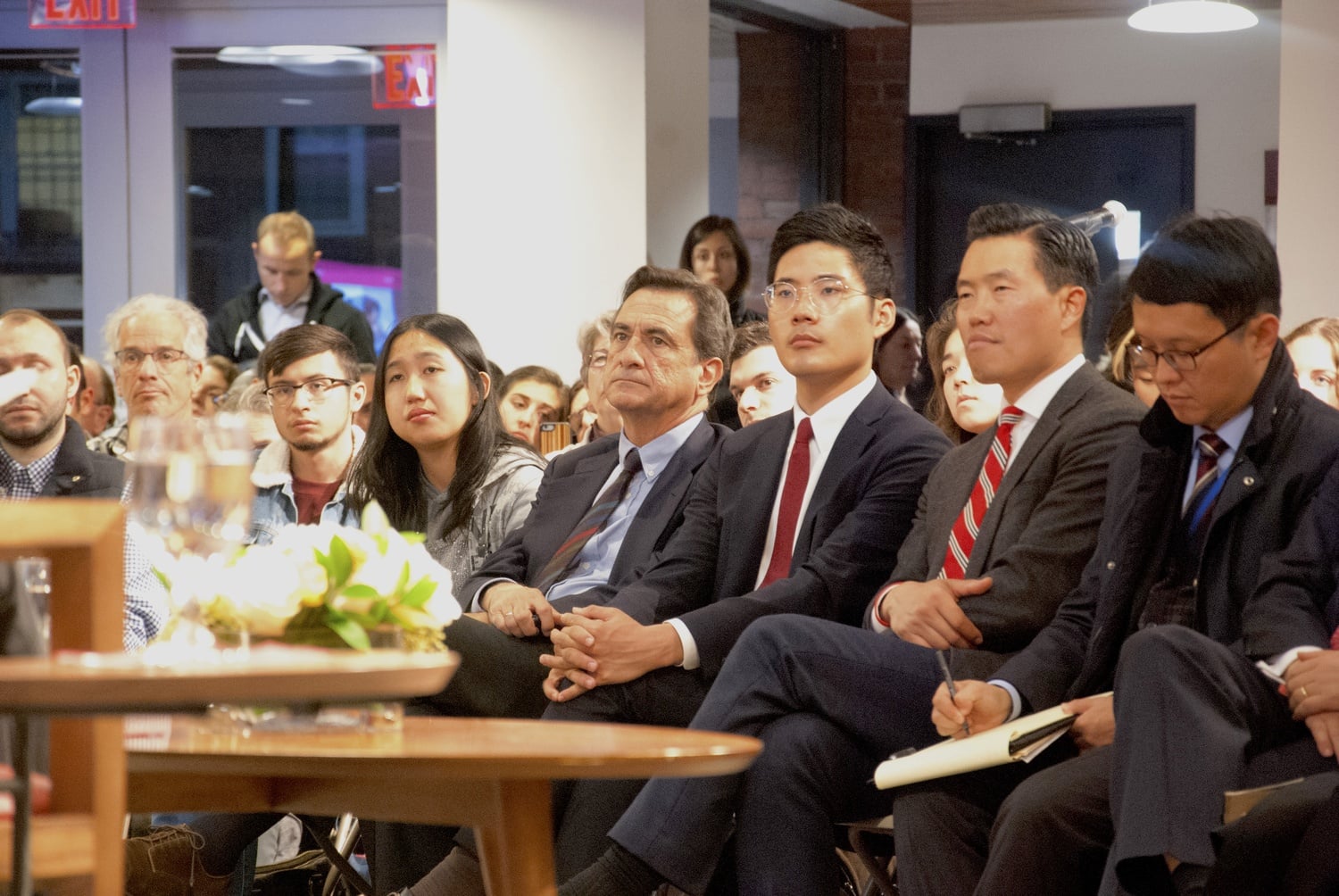 Audience members watch Ban Ki Moon at the JFK Forum.