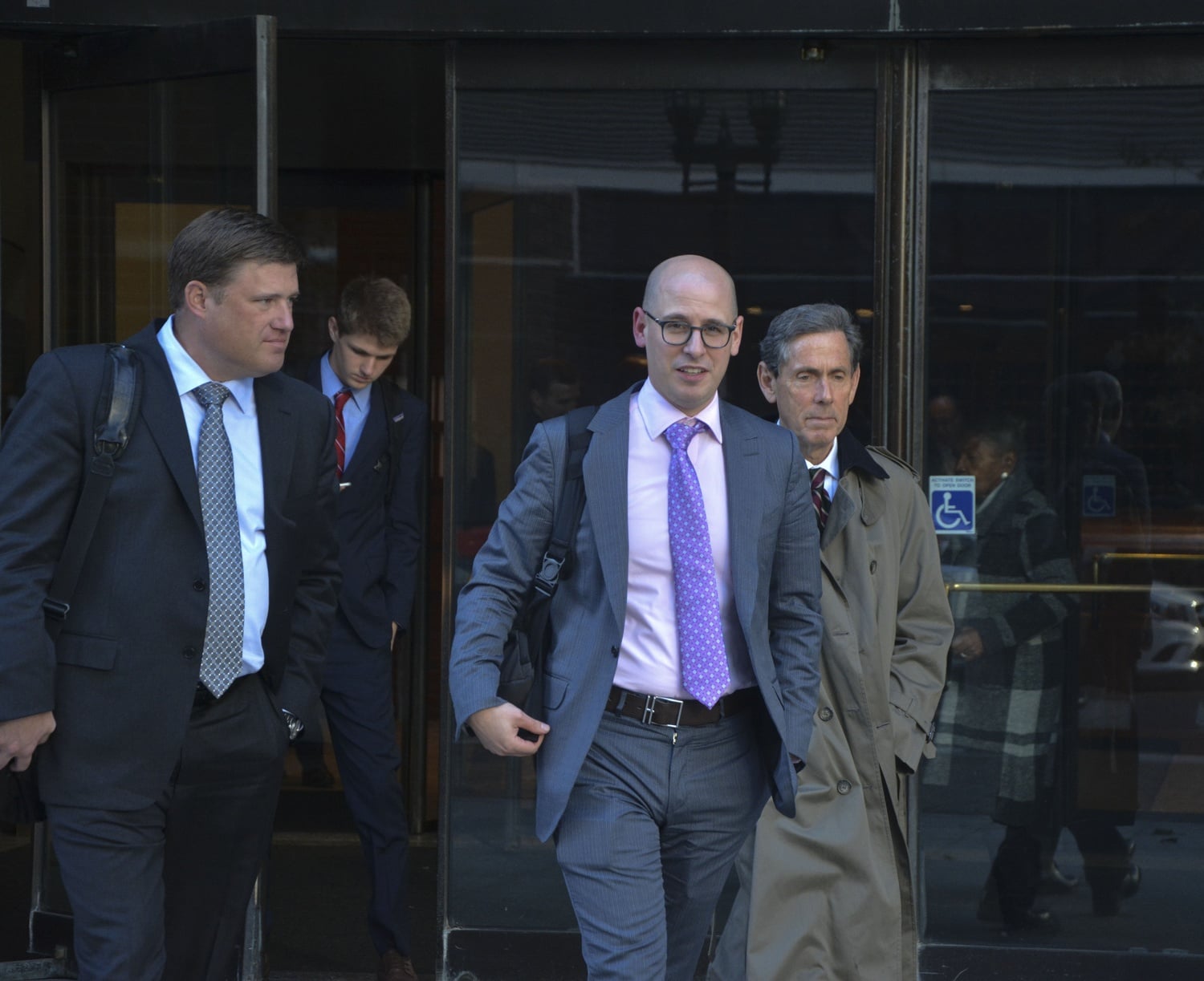 SFFA affiliates John M. Hughes (left), Adam K. Mortara (center), and Edward Blum (right) exit the court Thursday.