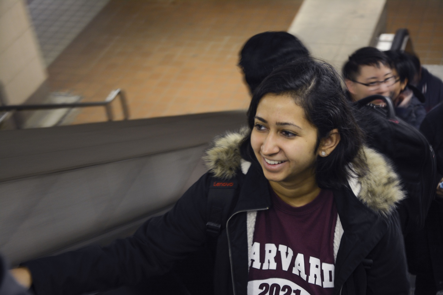 Roshni Chakraborty '21 rides an escalator as she travels to the courthouse Monday.