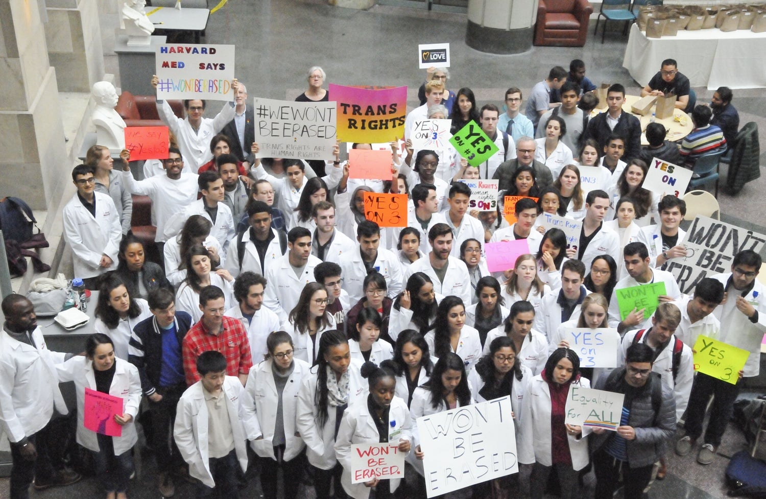 Students at Harvard Medical School demonstrate in support of transgender rights in the Tosteson Medical Center atrium on Thursday.