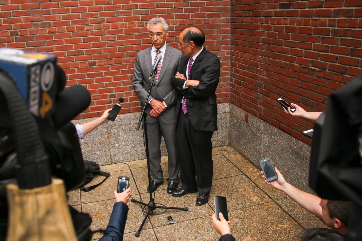 Seth P. Waxman '73 and William F. Lee '72 speak to members of the press outside John Joseph Moakley United States Courthouse immediately following the conclusion of the three-week-long Harvard admissions trial.